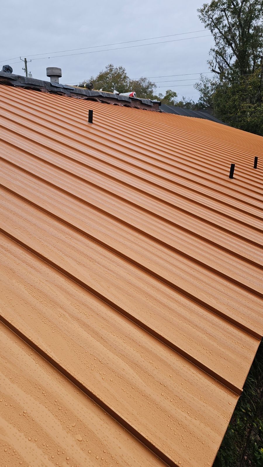Residential Re-Roof using MS Metals, Copper Penny, Standing Seam. by First Due Roofing