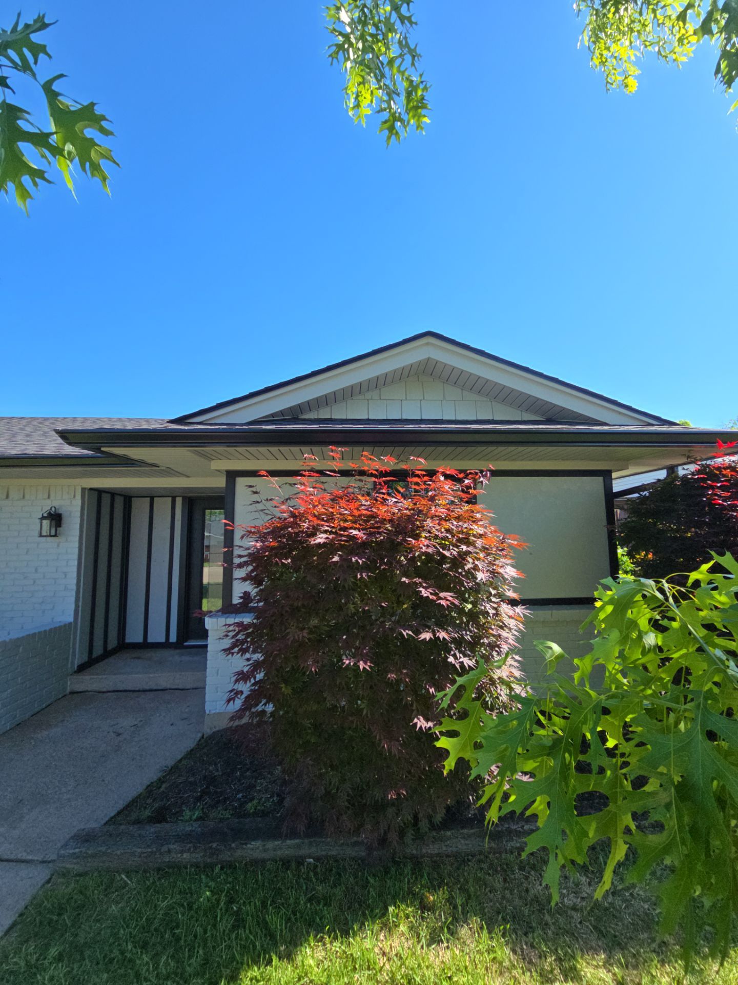 Exterior Home Paint Project with Different Surfaces by SLM General Contractors & Roofing
