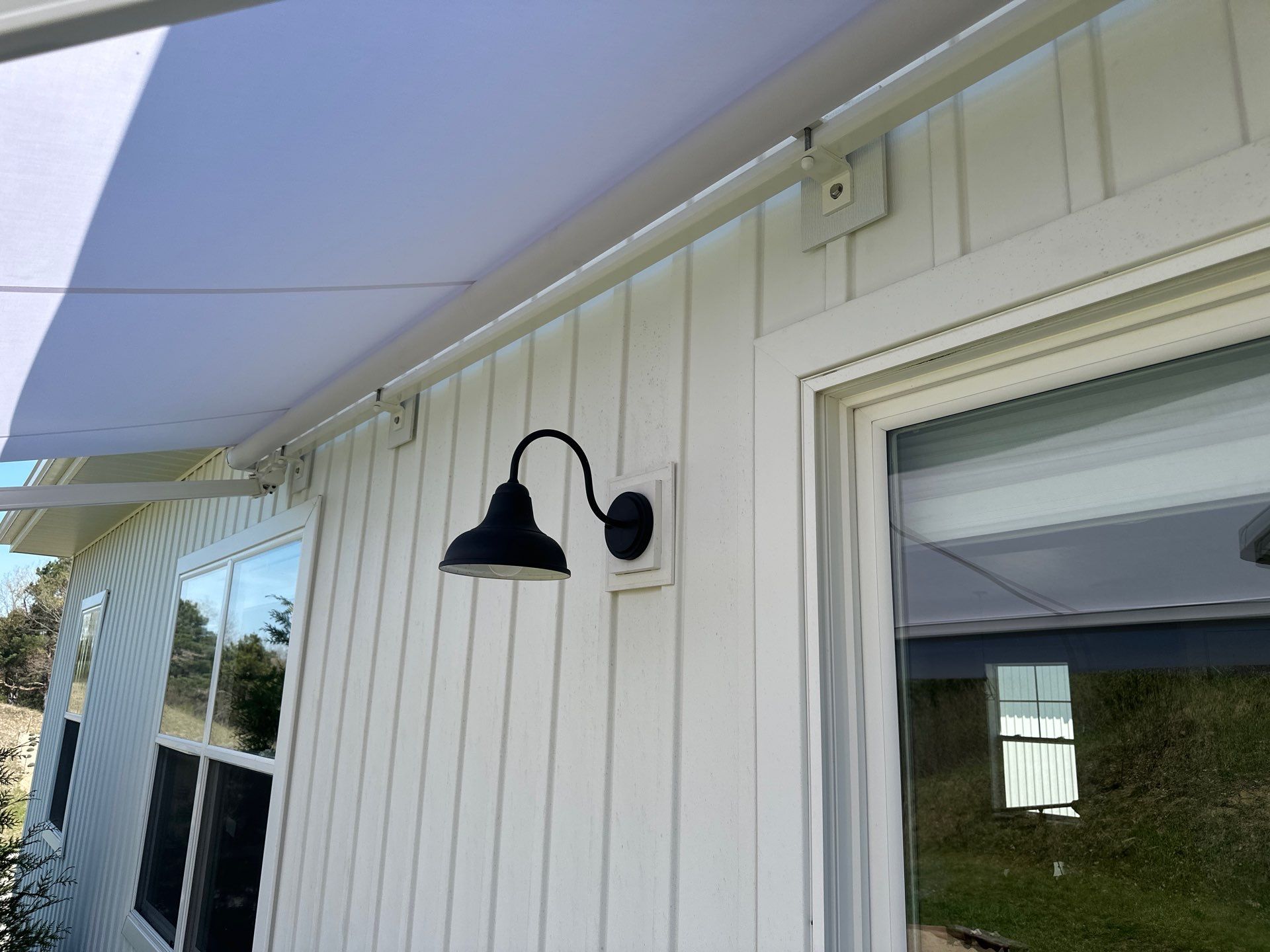 Sunesta Retractable Awning Installation for Traverse City Composite Deck by Rainbow Seamless Systems