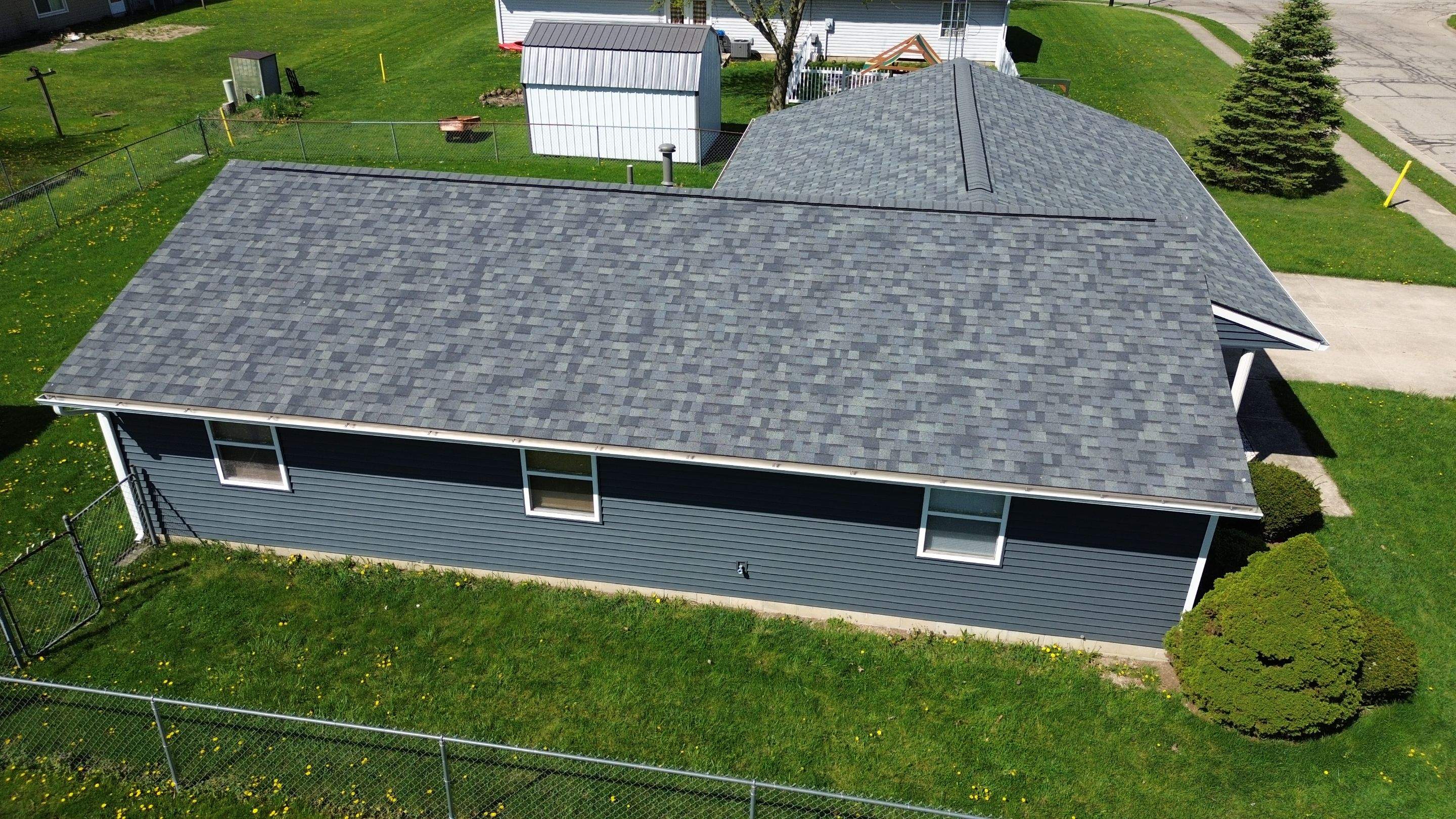 Storm Damage Residential Roof and Siding Installation by WIW Enterprises Inc