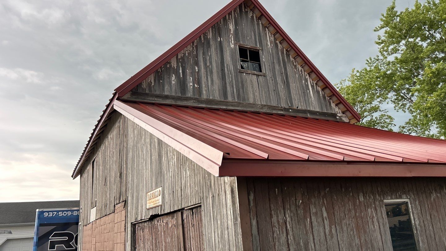 Residential Roofing Installation using Standing Seam Metal - Barn Red by RoofX 