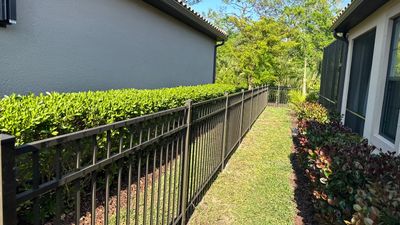 Aluminum Fence Installation using Black 3 Rail Aluminum Fence