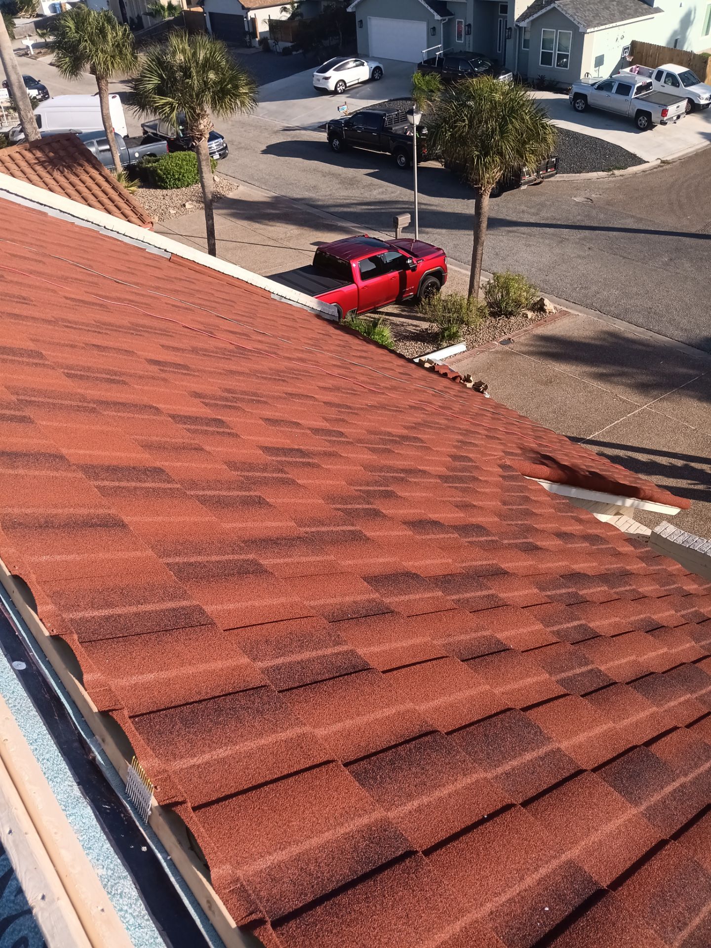 Off with the Tile and on with the TILCOR stone coated metal.  by Bayfront Roofing and Construction