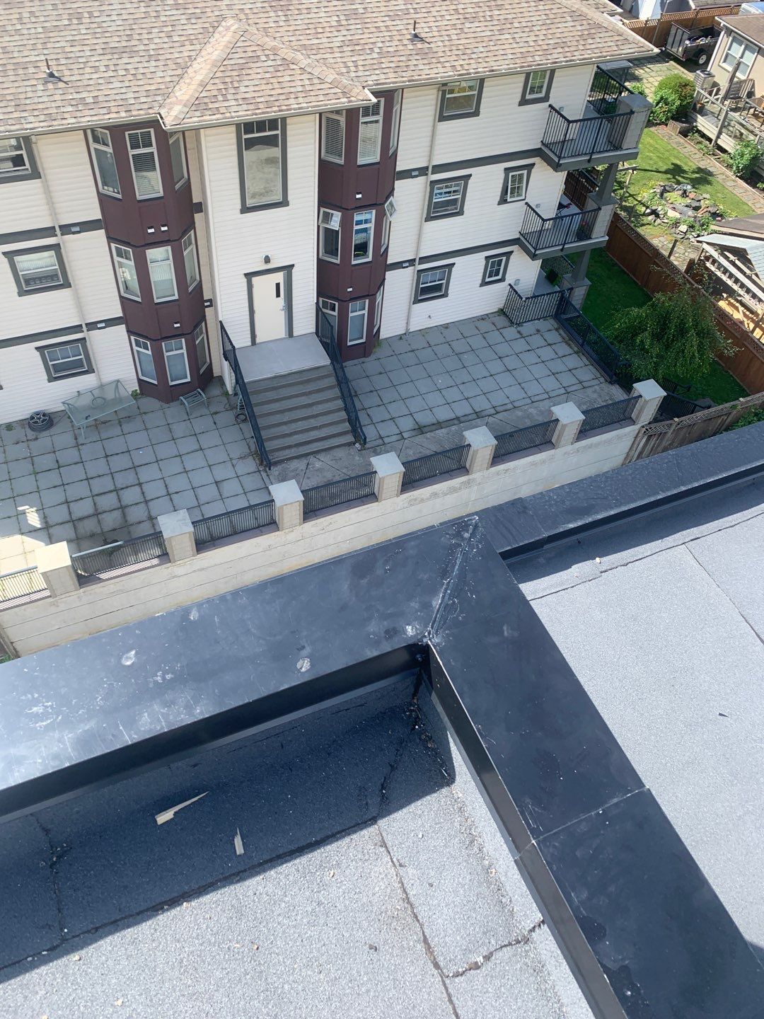 Large apartment with sbs, shingles and prolok metal  by Top Notch Roofing Inc