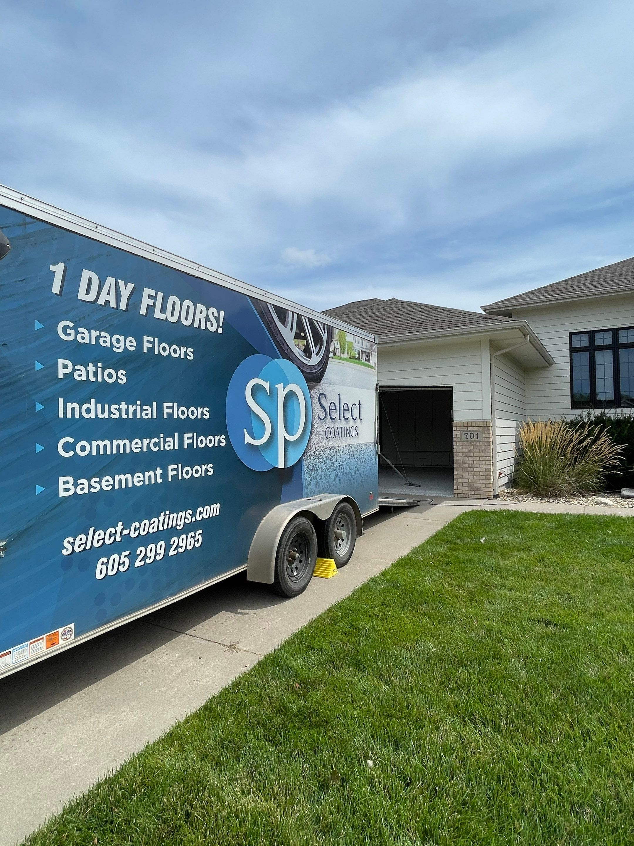 Cabin FEver Flake Garage Floor Coating Installation in Sioux Falls by Select Painting, Coatings & Garage Cabinets