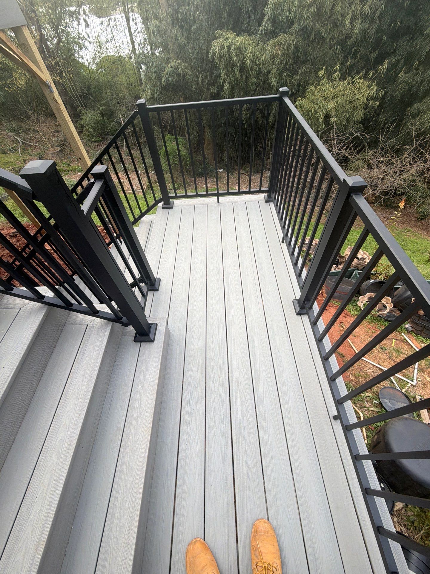 Covered Porch and Deck Build using Deckorators Venture Series Decking and Trex Select Aluminum Railing by Nelson Exteriors