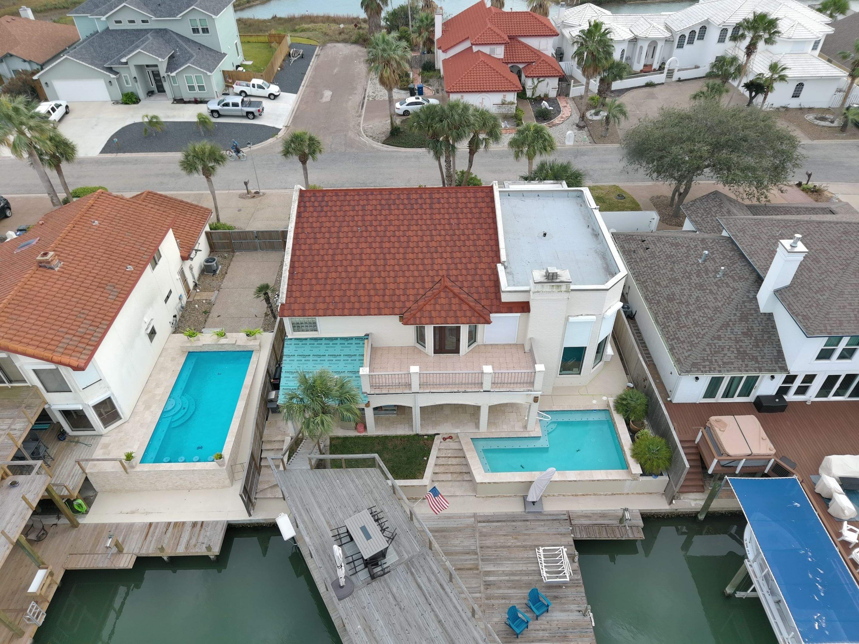 Off with the Tile and on with the TILCOR stone coated metal.  by Bayfront Roofing and Construction