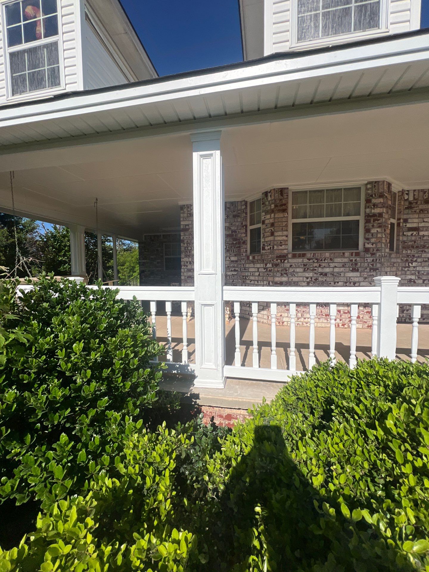 siding and porch railing replacement  in Yukon by McCann's Roofing and Construction