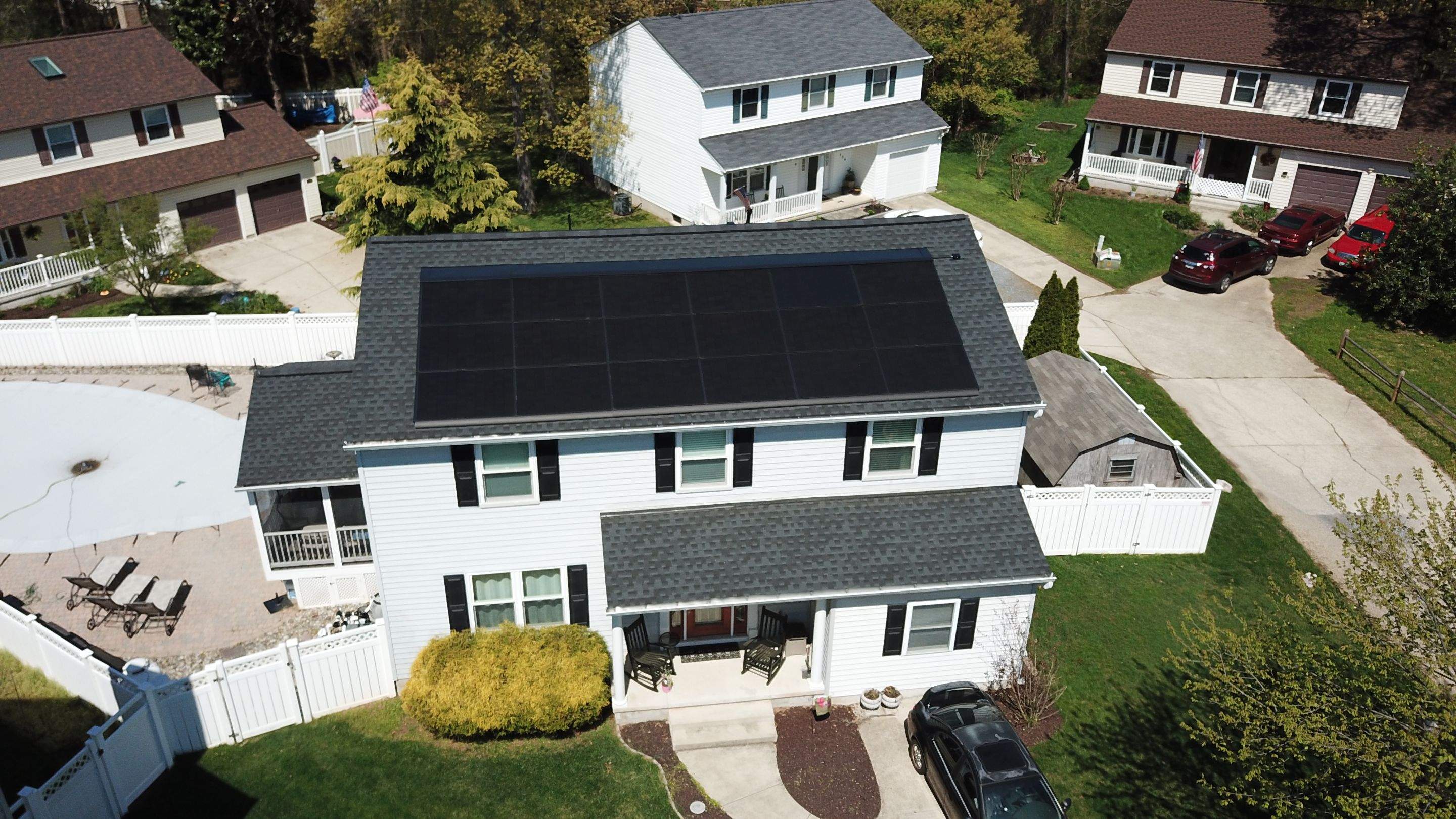 Roof Replacement with GAF Decotech integrated solar panels by American Home Contractors