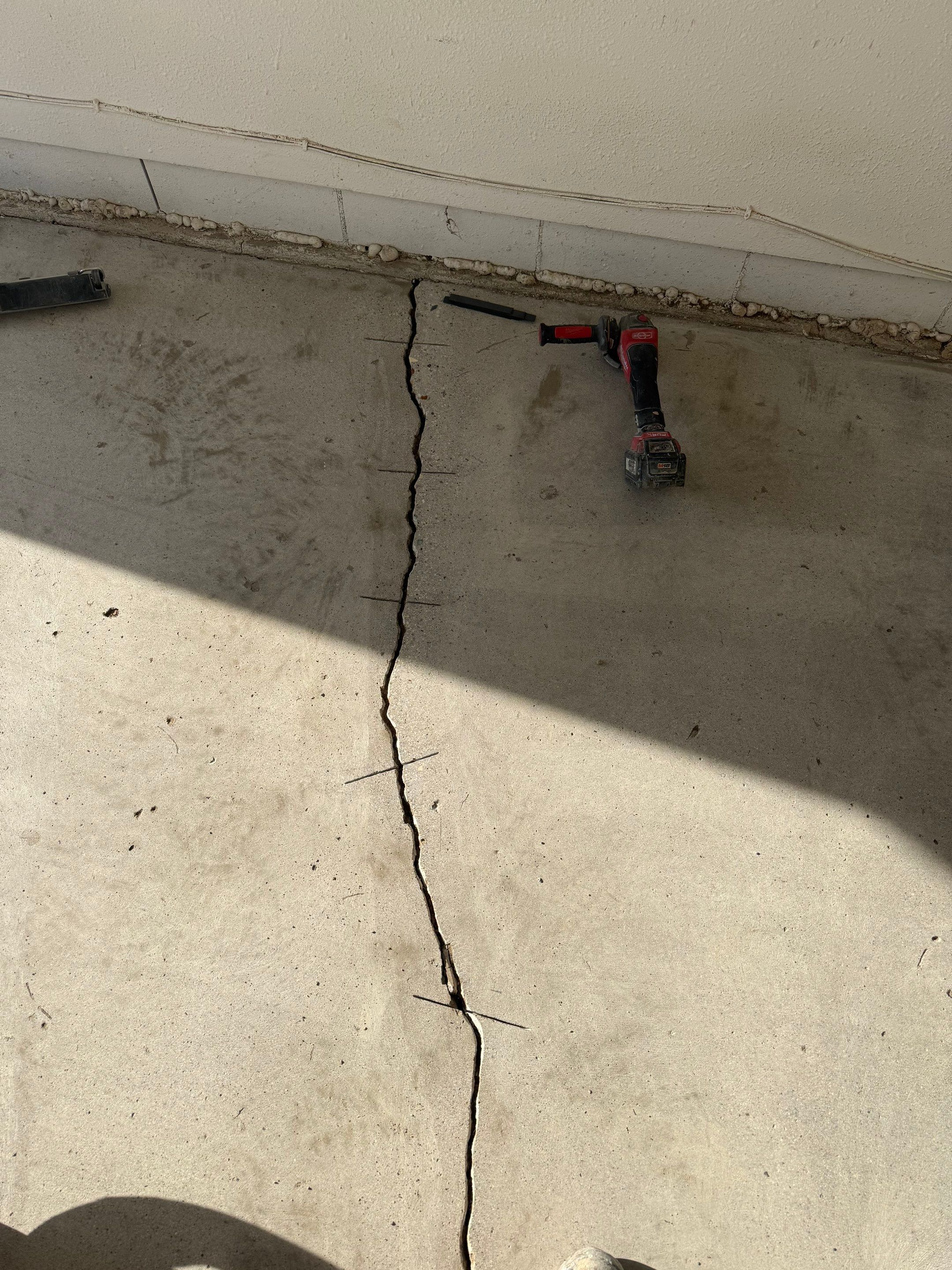 Feather Grey Garage Floor Coating and Crack Repair in Beresford by Select Painting, Coatings & Garage Cabinets