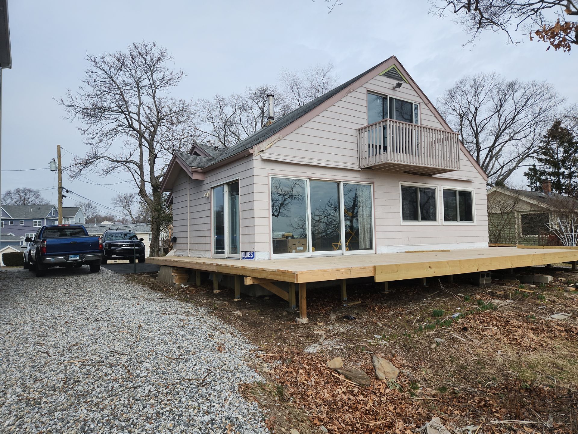 Milford Exterior Renovation Featuring Custom Siding and Wood Deck Installation by A Plus Exterior