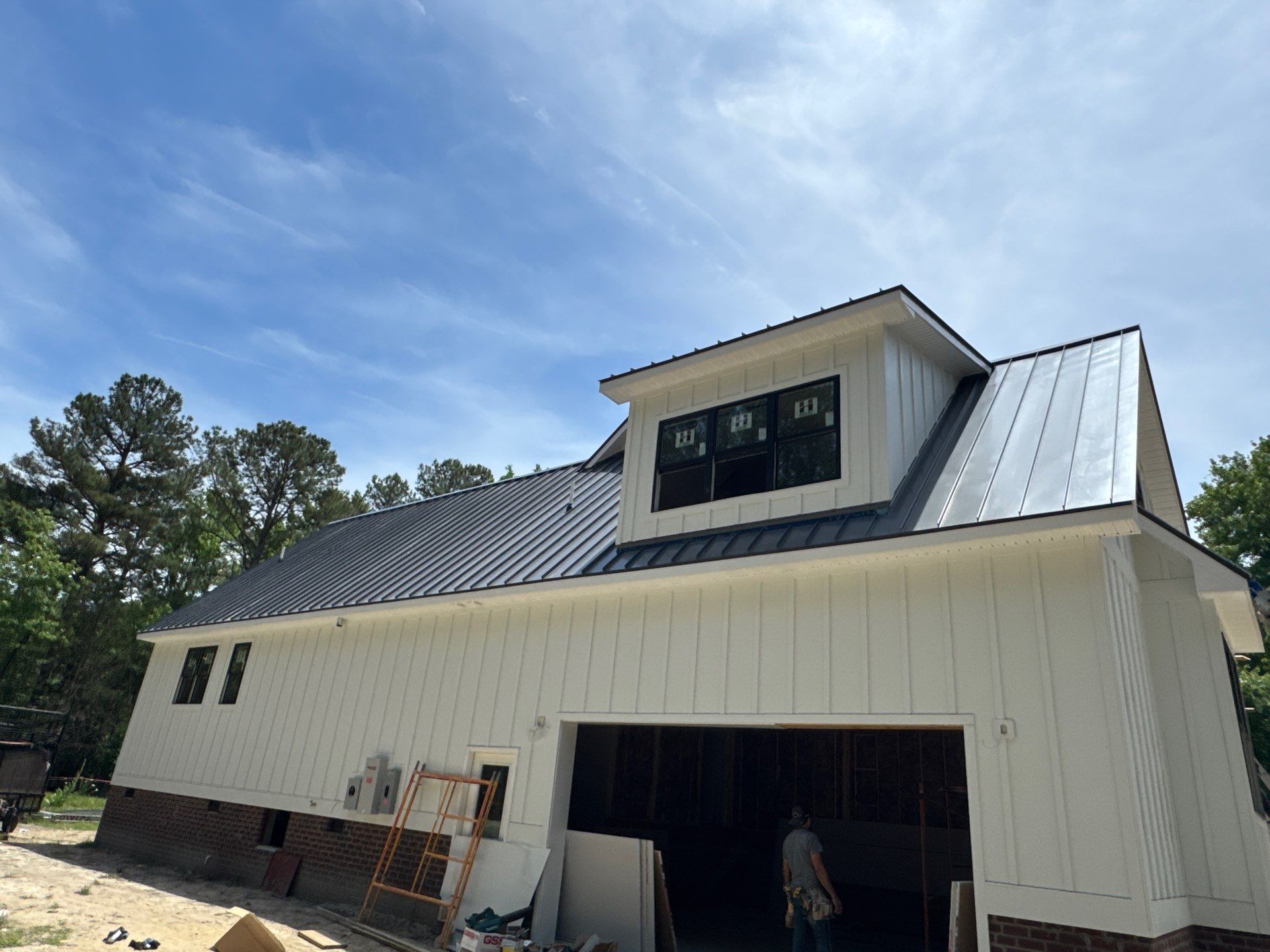 Custom New Construction Home Featuring Standing Seam Metal Roofing in Port Haywood by Cade Construction