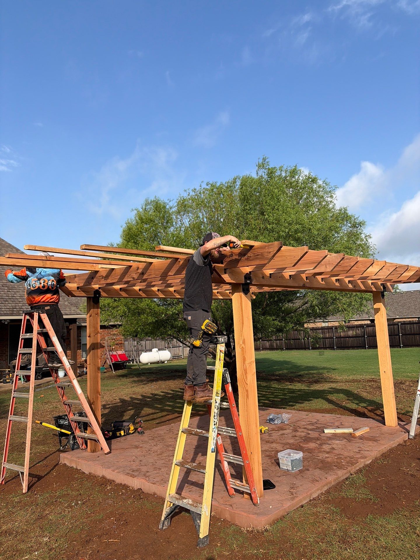 Stamped Concrete & Custom Pergola Build by Clays Services Inc