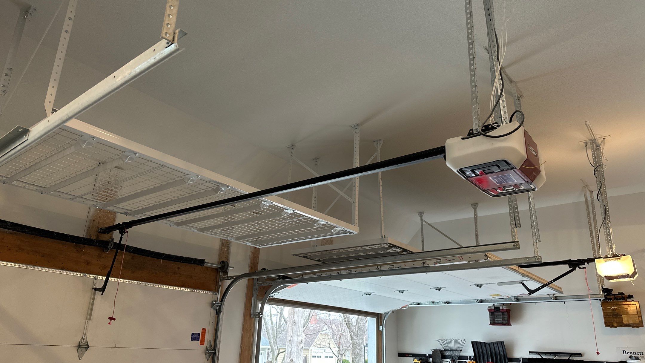 Max R. upgraded his garage with overhead racks and a New floor  by Banner Garage
