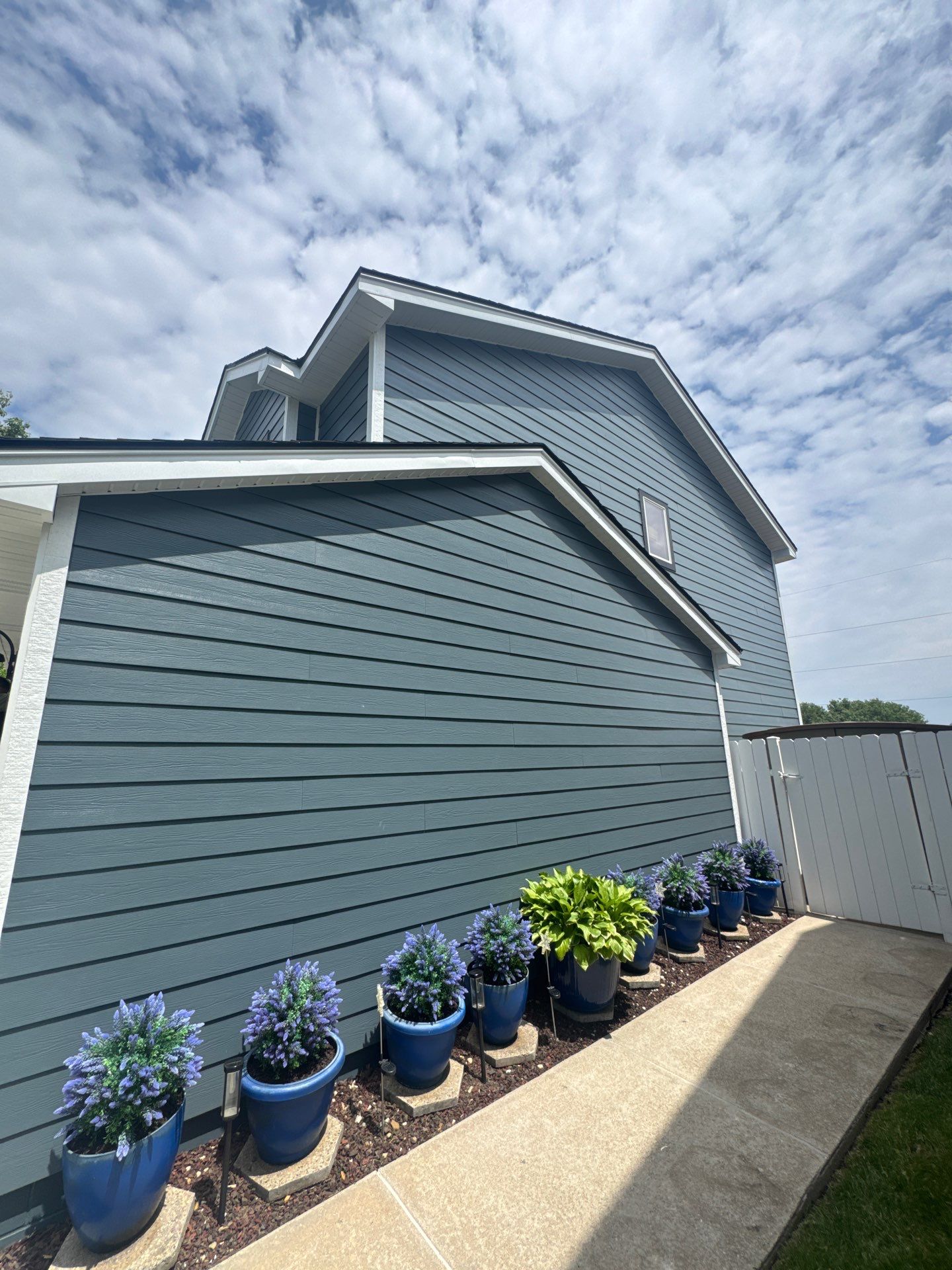 James Hardie Siding and Window Replacement with Arctic White Trim by Carps Complete Exteriors
