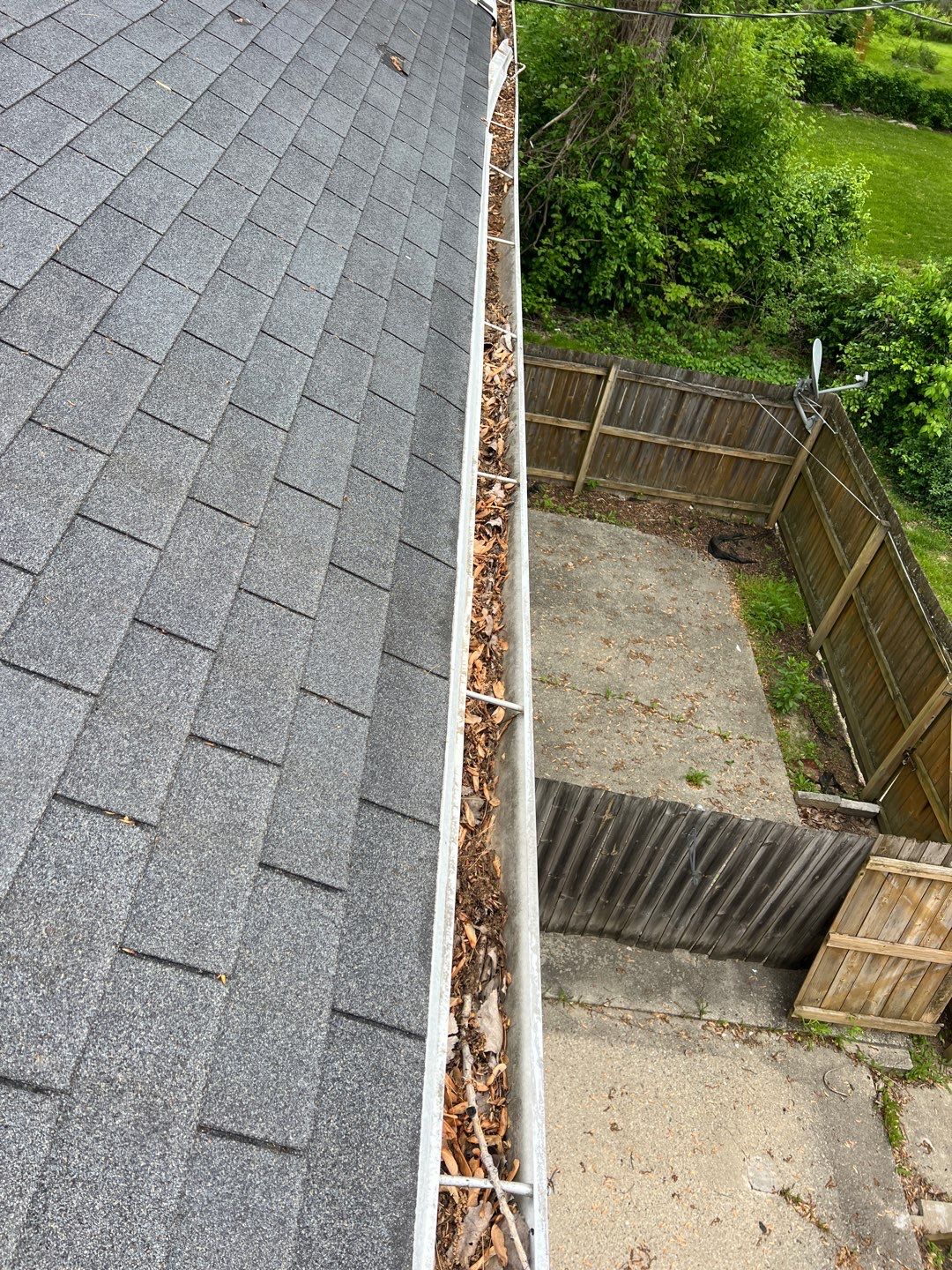 Commercial gutter cleaning Indiana before photo with filled gutters