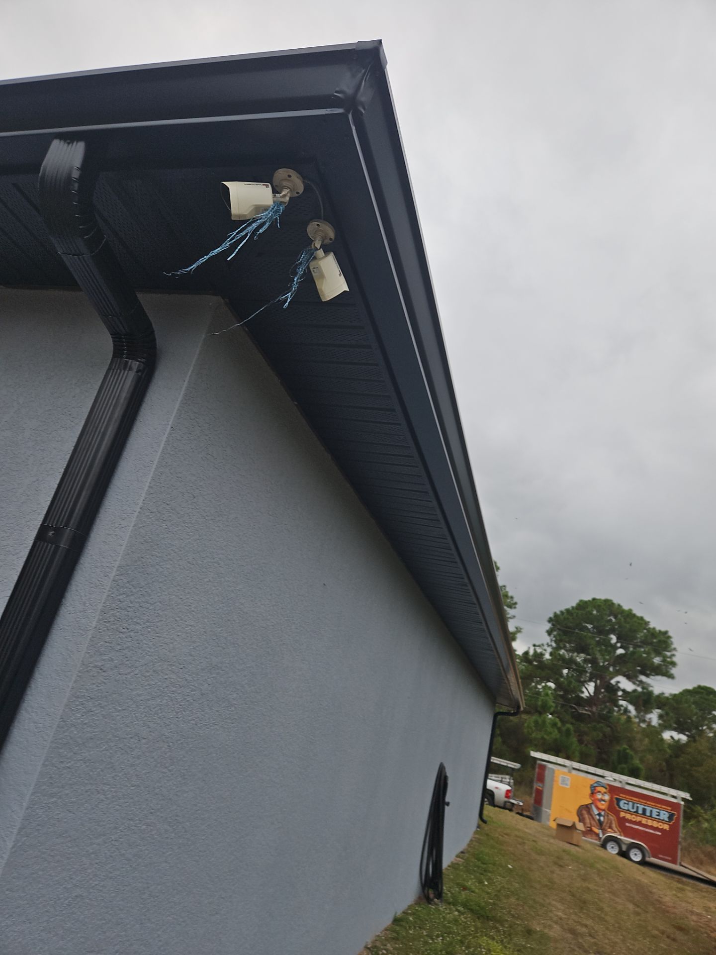 Black Seamless Gutters & Soffit/Fascia in Lehigh Acres FL by Gutter Professors