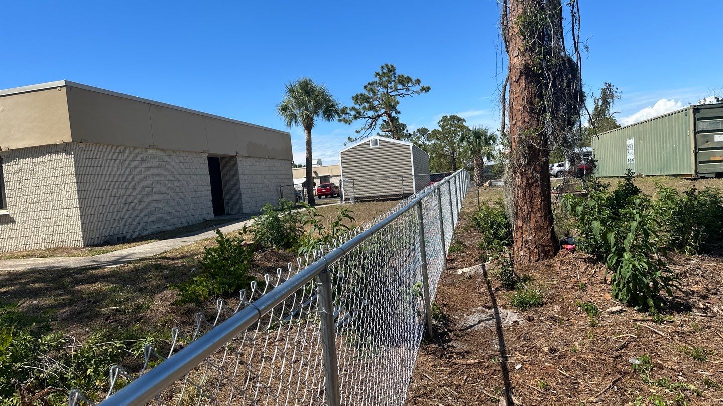 Commercial Chainlink and Vinyl Fence With Aluminum Framed Gates On Dumpster Enclosure by Asap fence and gates, LLC