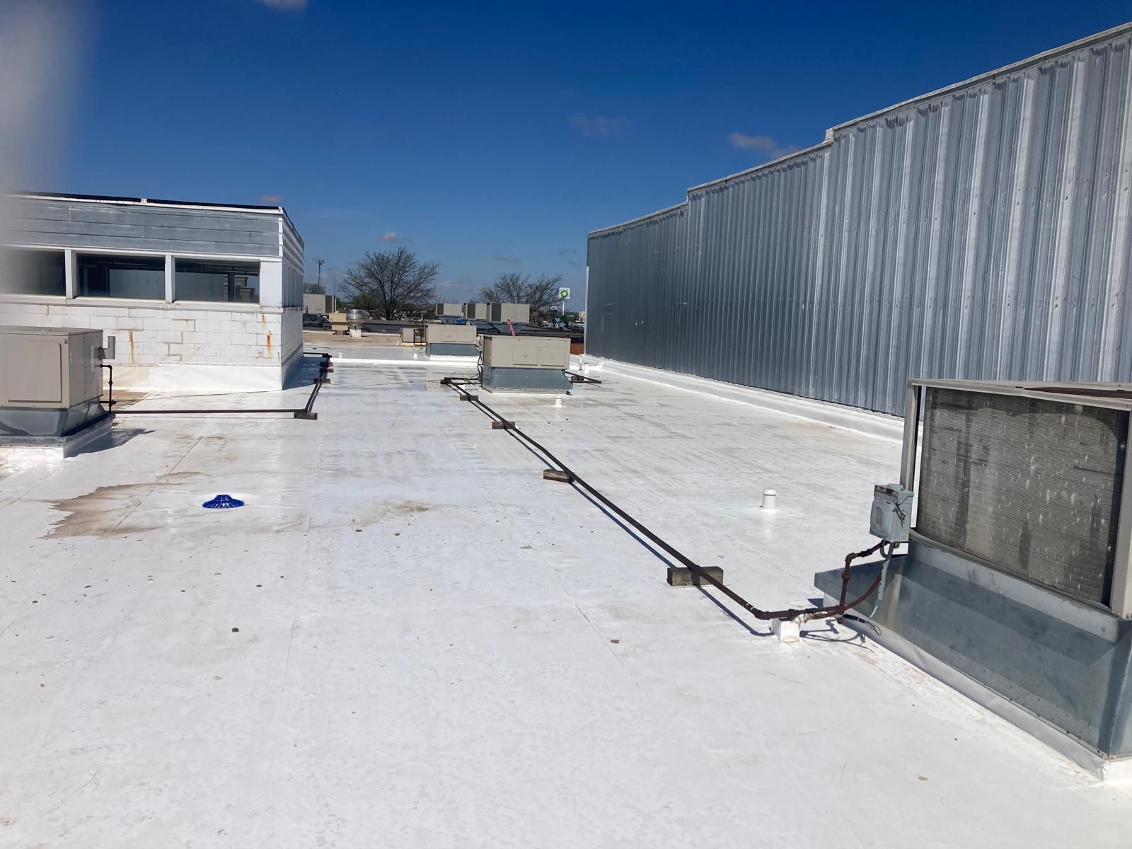 Full Roof Tear-off with new Code ISO insulation and 50 Mil Membrane by Grell Roofing, LLC