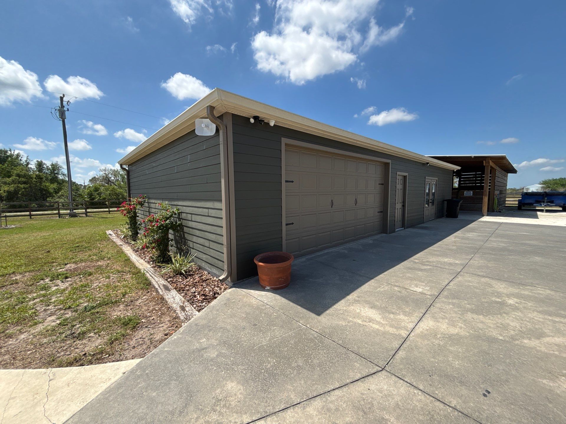  7-inch White seamless gutters and downspouts in Myakka City FL by Gutter Professors