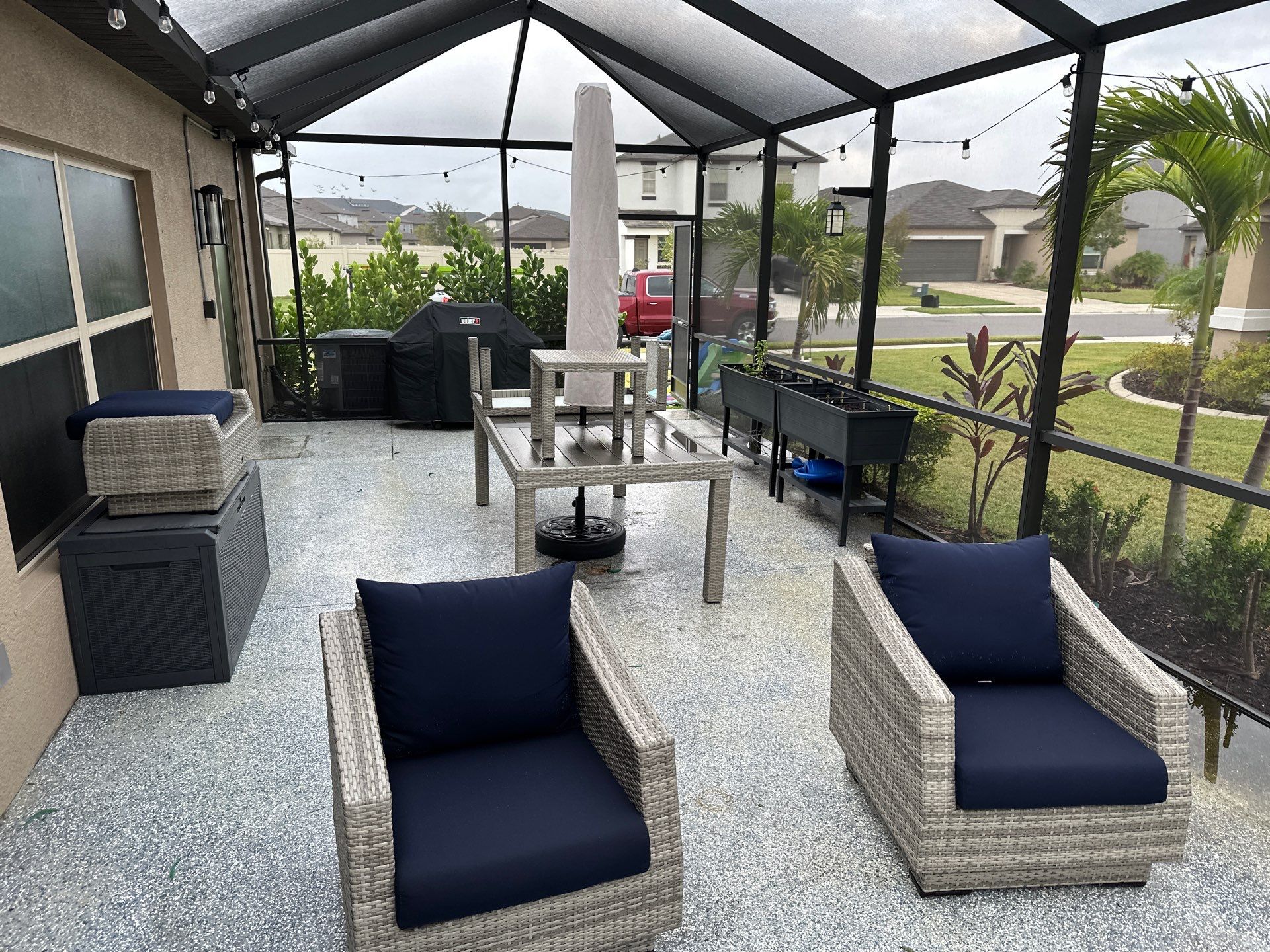 Lanai & Patio Cleaning with Epoxy-Coated Concrete Floor in Trevesta Community, Palmetto, FL | Sunshine AquaWash by Sunshine AquaWash