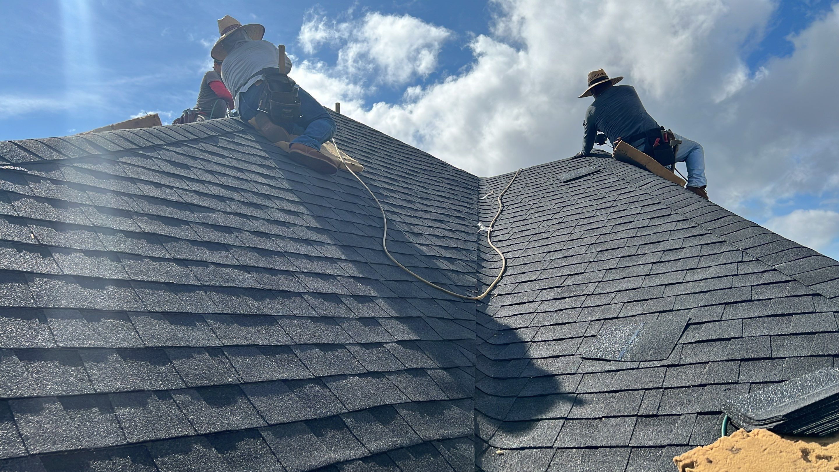 Slate-Gray Roof on Stone-Front Home — Spring, TX by PL Roofing & SB Roofing, LLC.