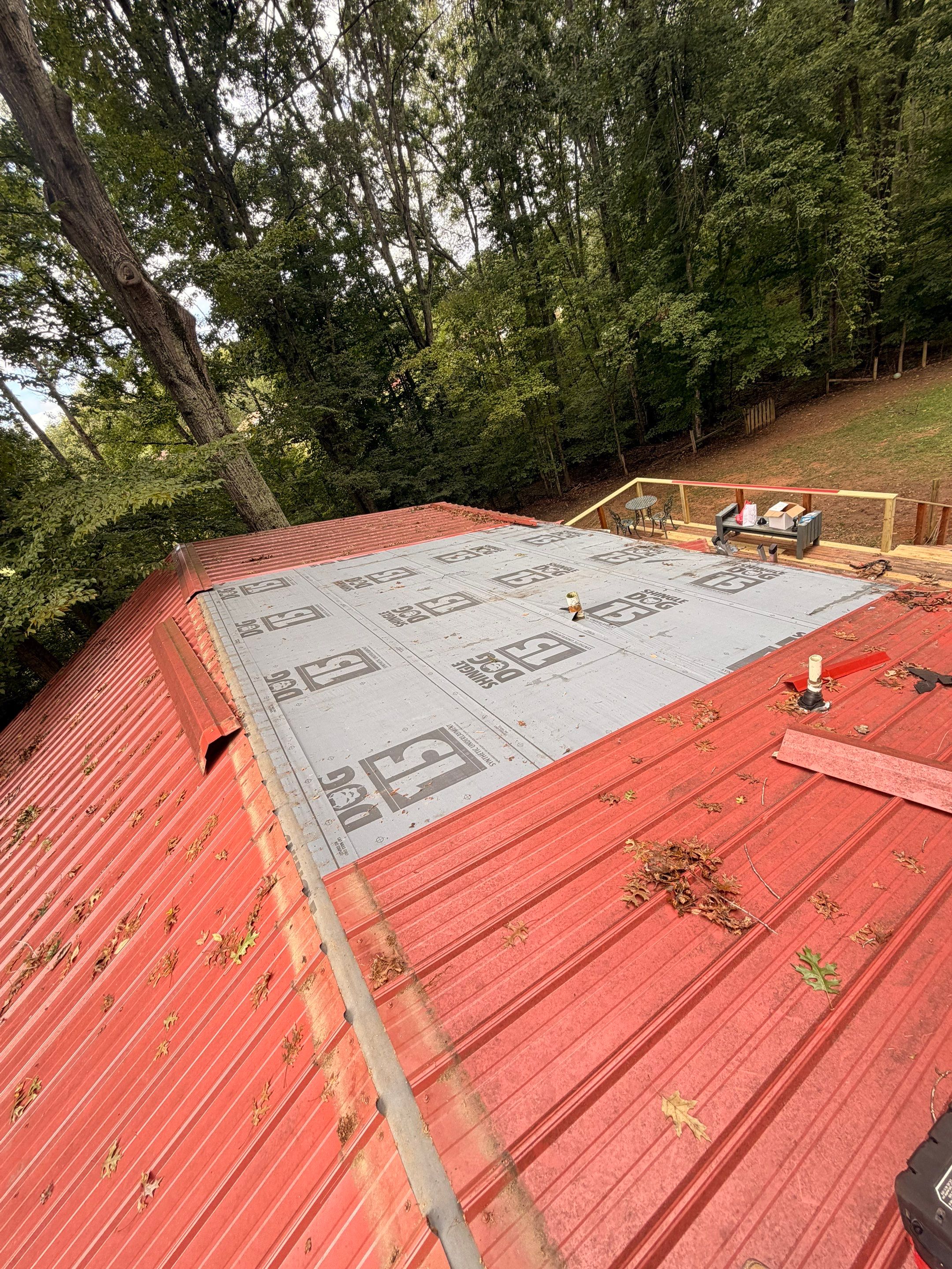 Red Metal Roof Restoration and Wood Fascia Replacement in Barboursville by Cade Construction
