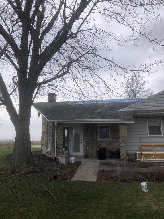 Storm damage roof replacement by Nitro Roofing and Construction