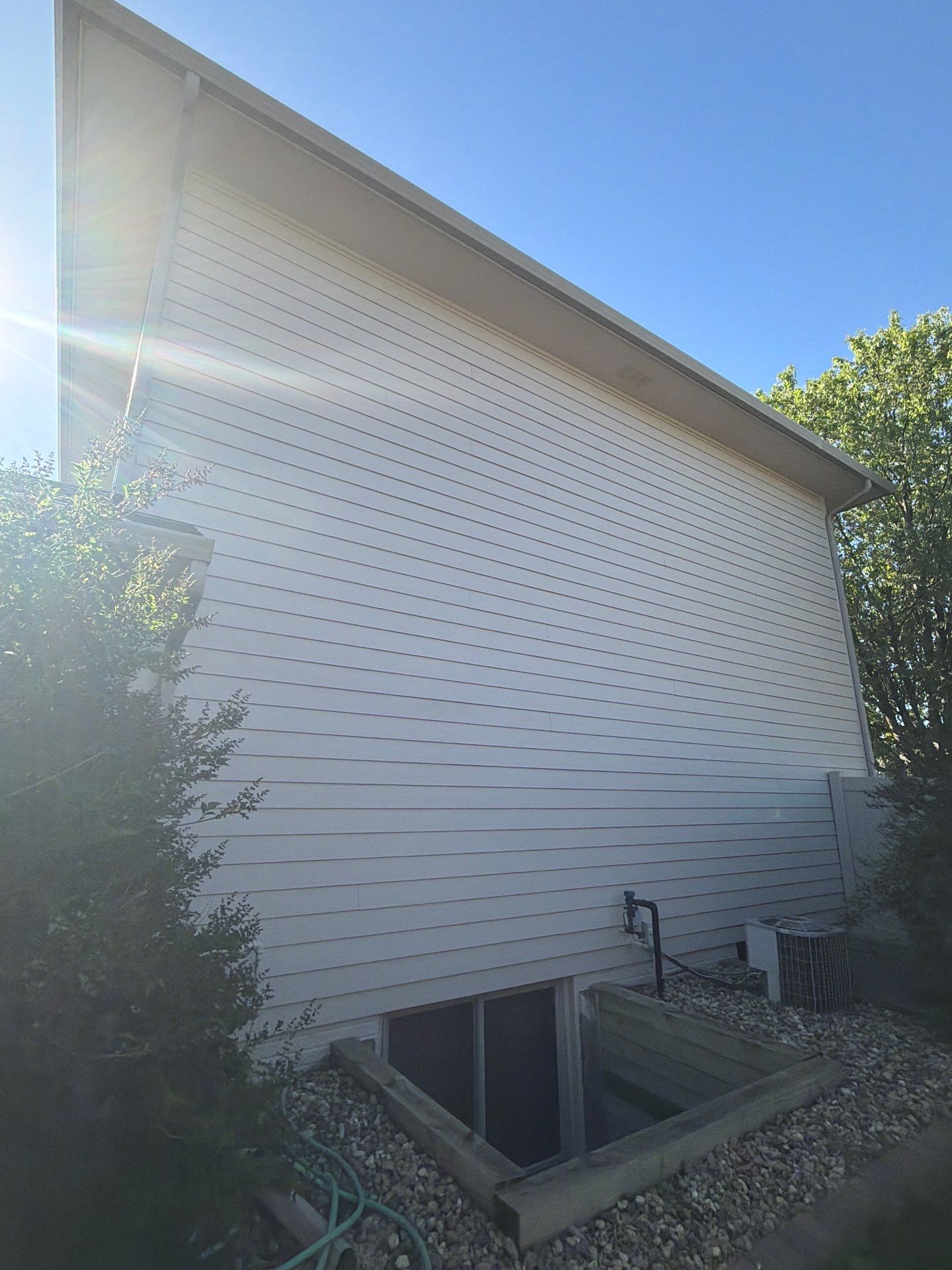 Residential Exterior Painting with Shutter and Trim Updates in Sioux Falls by Select Painting, Coatings & Garage Cabinets