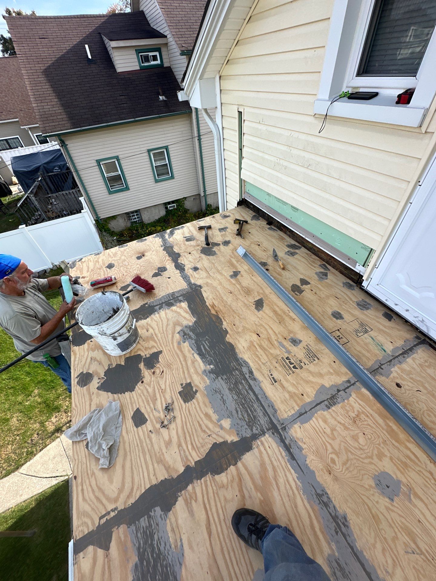 Rebuild balcony flat roofing TREX decking stairway and Railings in Wyandotte, MI by Northwest Construction 