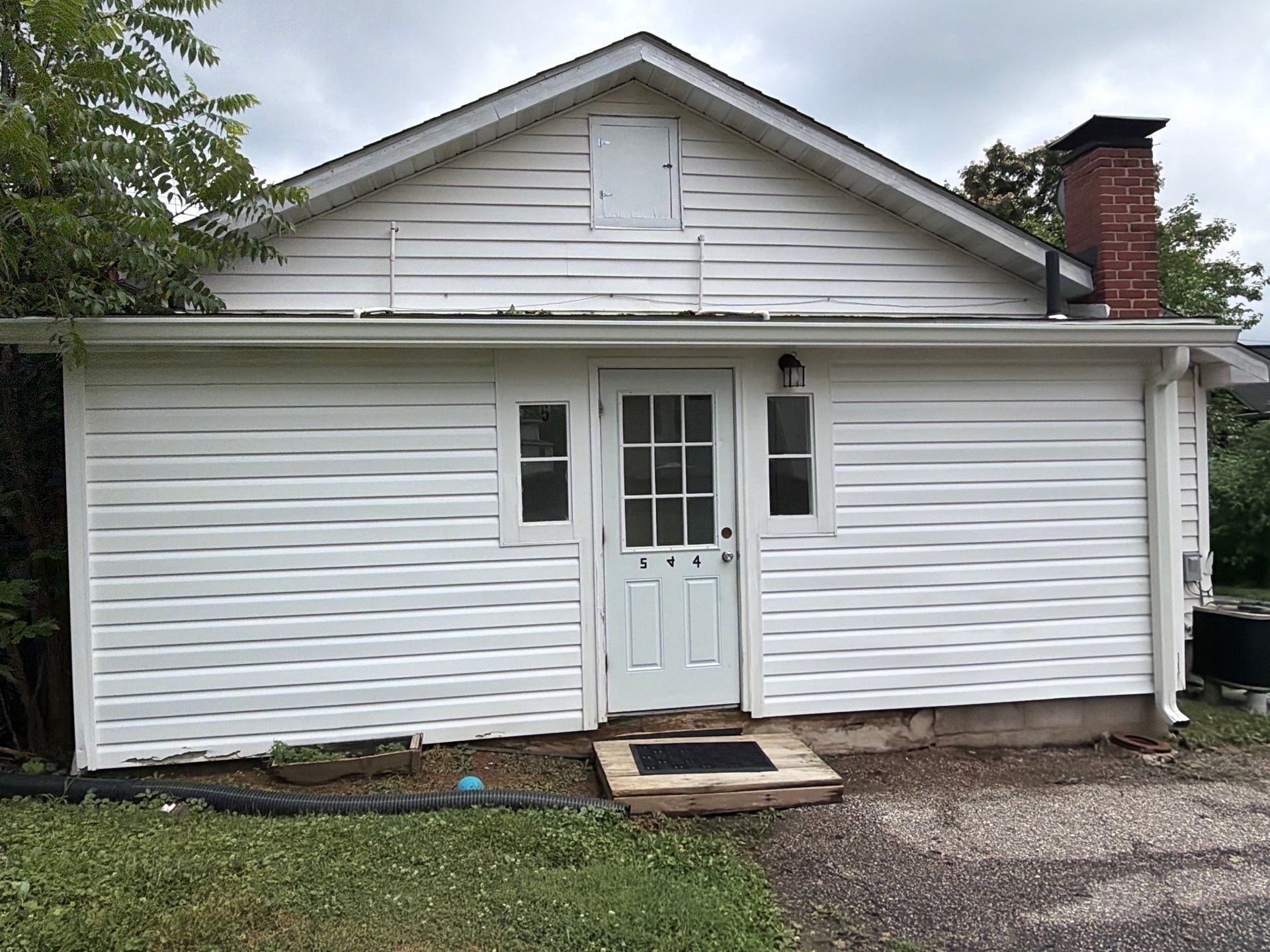 Whole-Property House Washing for Vinyl Siding and Stone Accents in Sykesville by Baltimore Pressure Washers Inc.