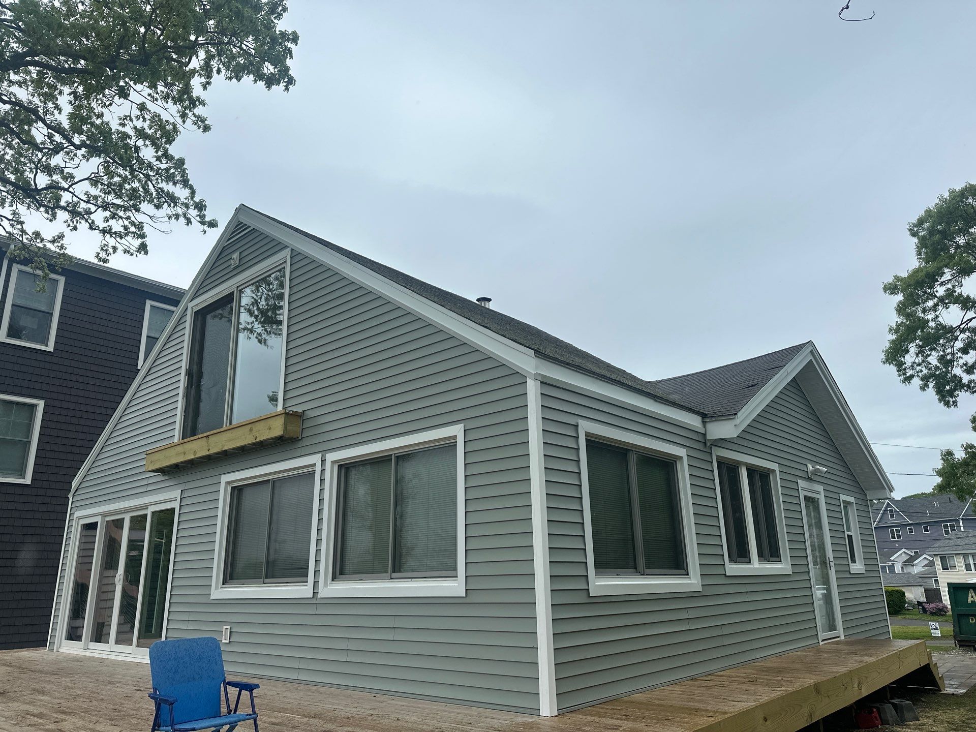Milford Exterior Renovation Featuring Custom Siding and Wood Deck Installation by A Plus Exterior