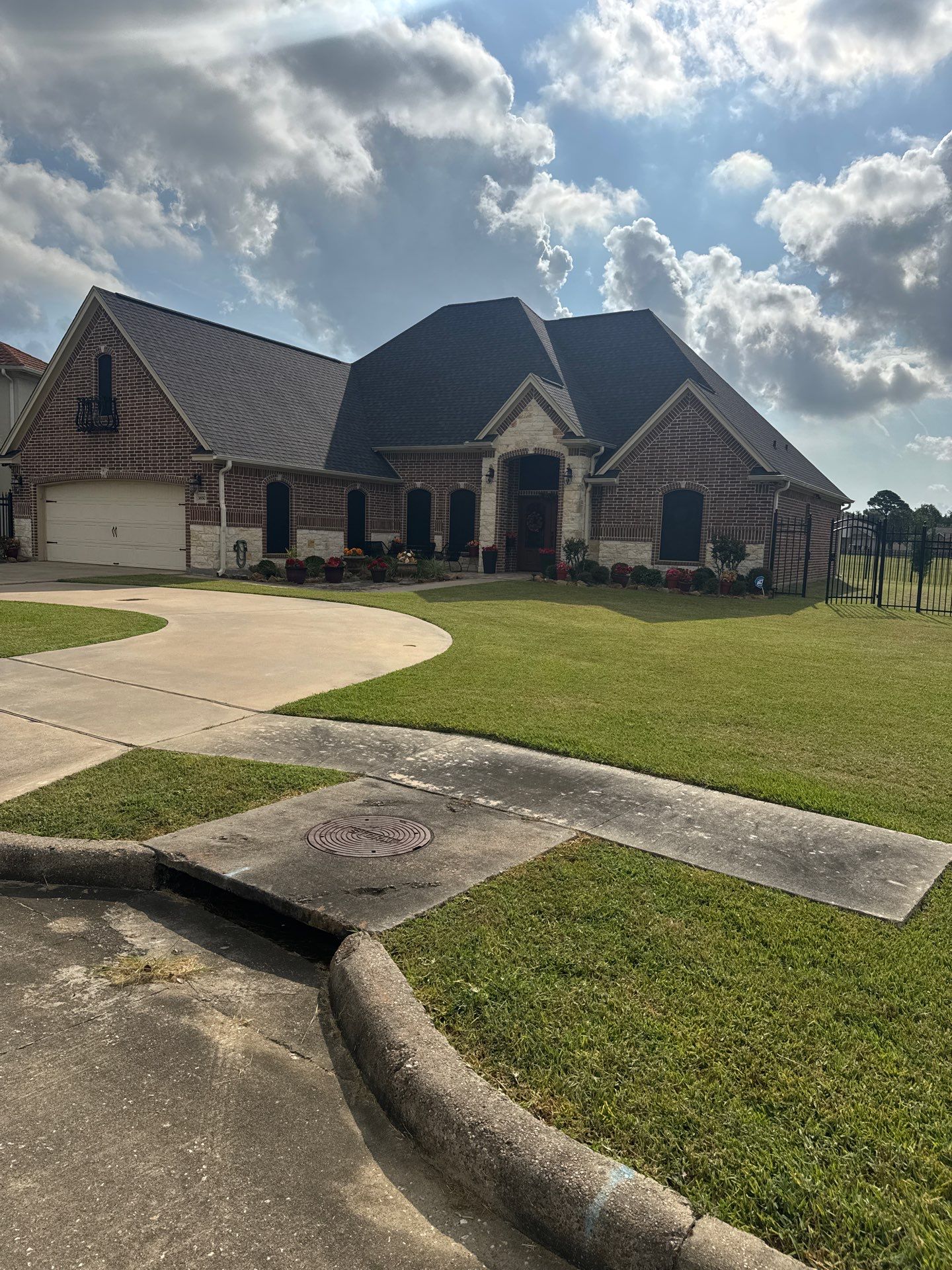 Residential House Wash and Comprehensive Concrete Cleaning in Port Arthur by Zeal Power Washing