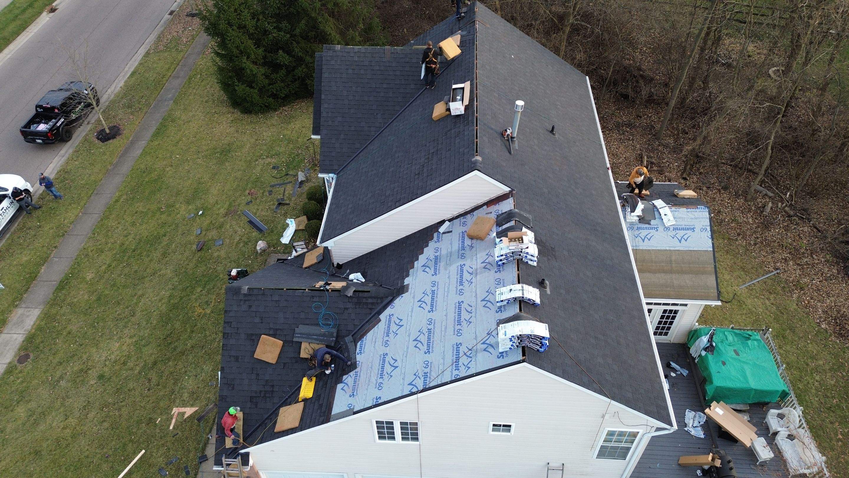 Walden Ponds - Pristine Black and Hydro Flo Gutter Guards by Tamlin Roofing