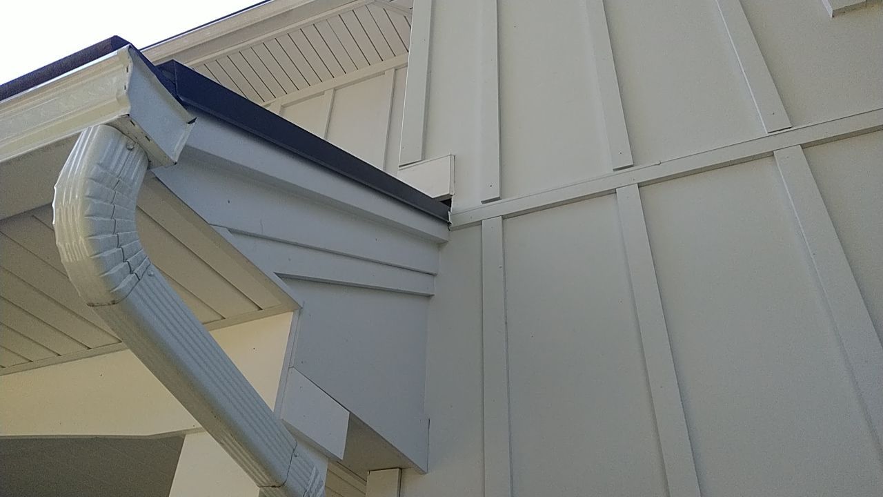 James Hardie Siding  using James Hardie Board and Batten, White by Absolute Roofing and Construction