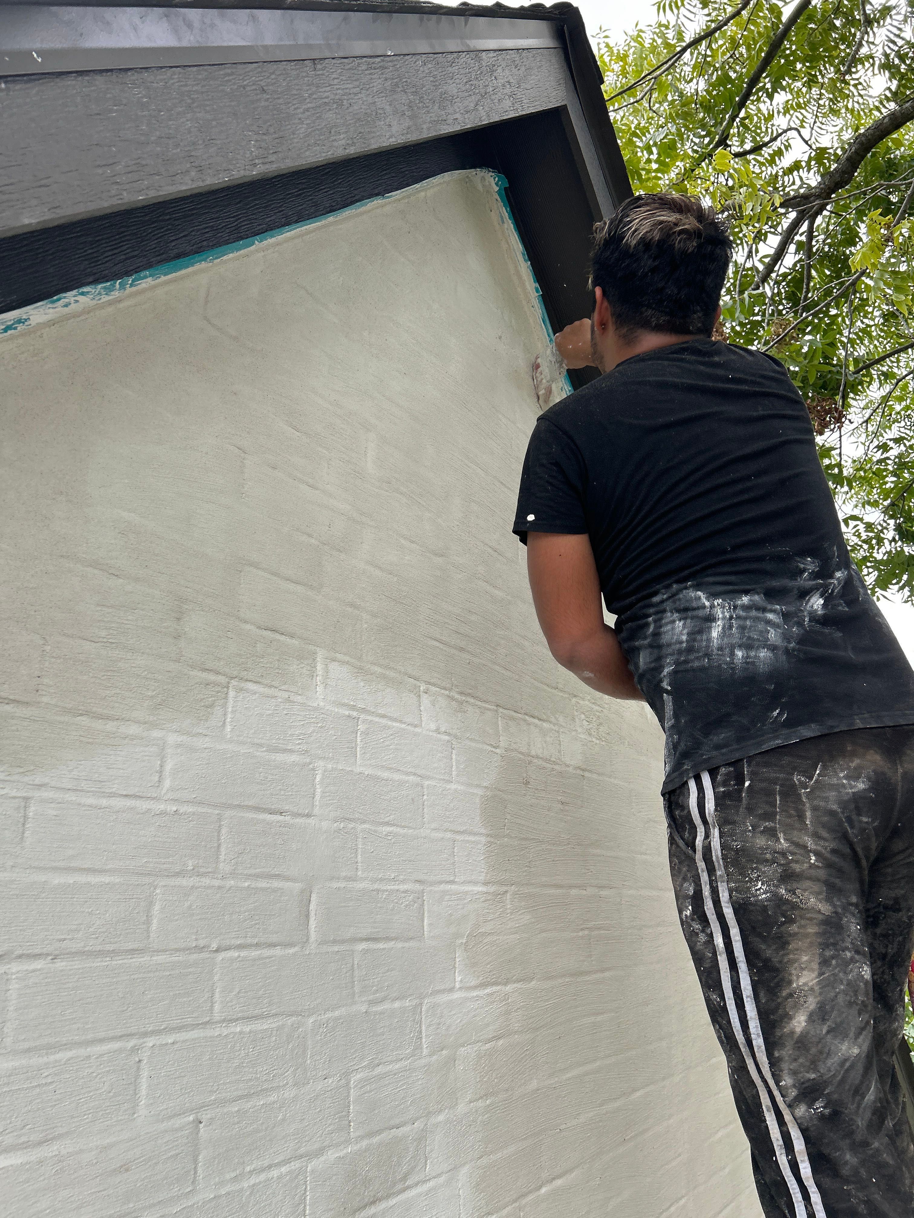 Midtown Elegance: Brickwork with Slurry Finish Refinement by Apex Conventional Stucco Llc