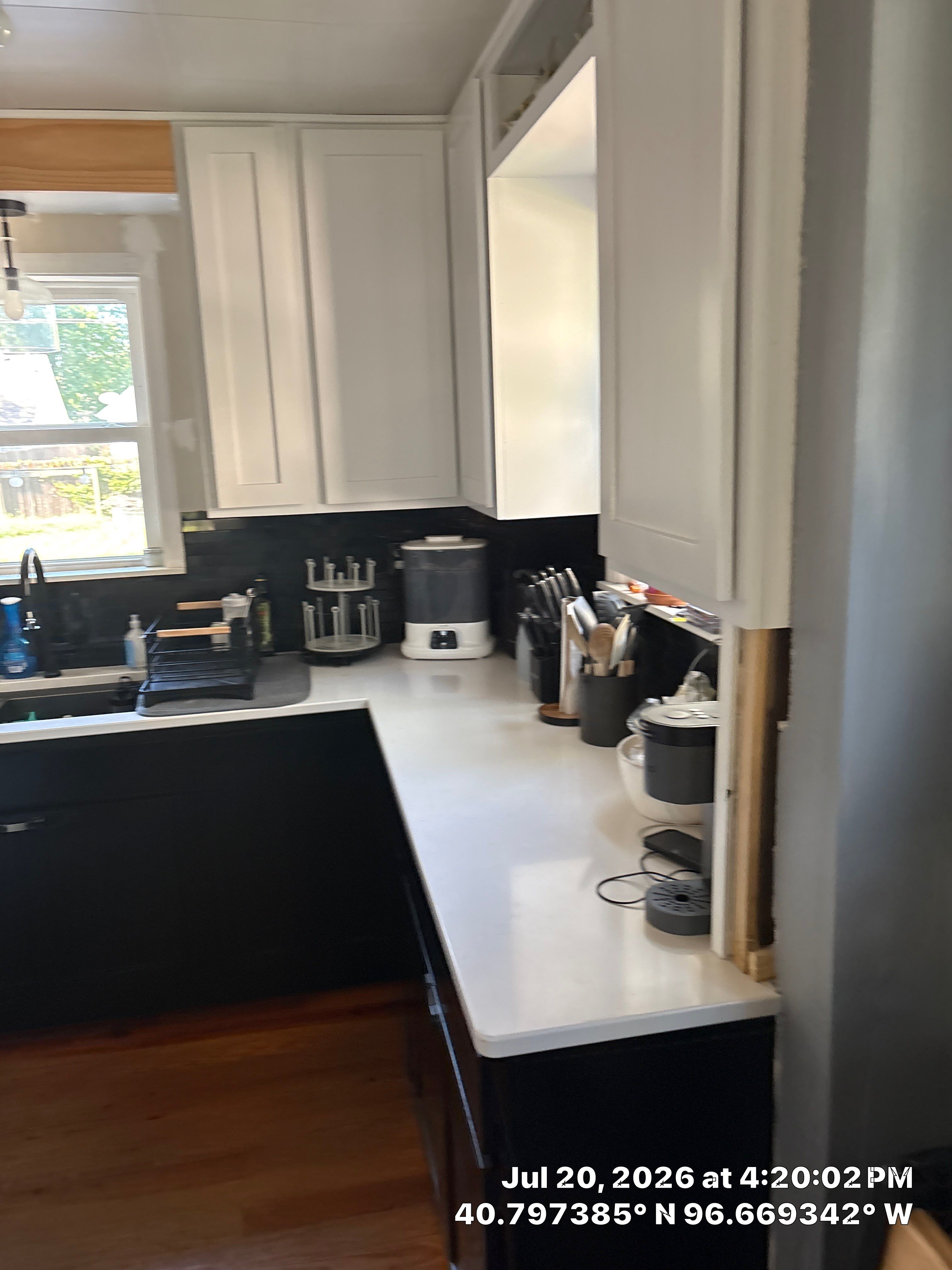 Kitchen Remodel in Lincoln Nebraska Featuring Two-Tone Cabinetry and Black Backsplash by CompanyCam Sales Demo