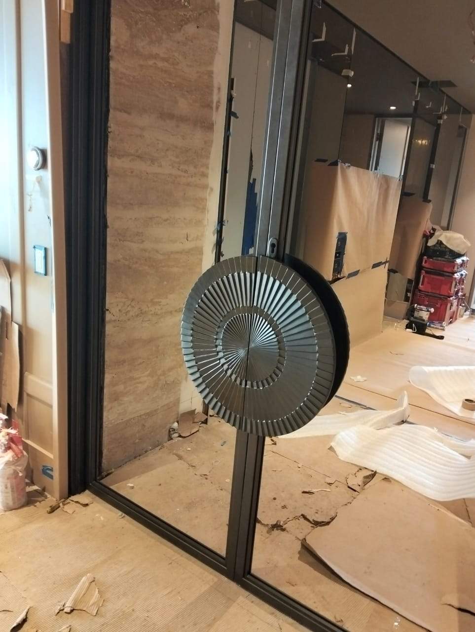Modern Black Frame Double Door Installation with Custom Radial Hardware by Solara Custom Living
