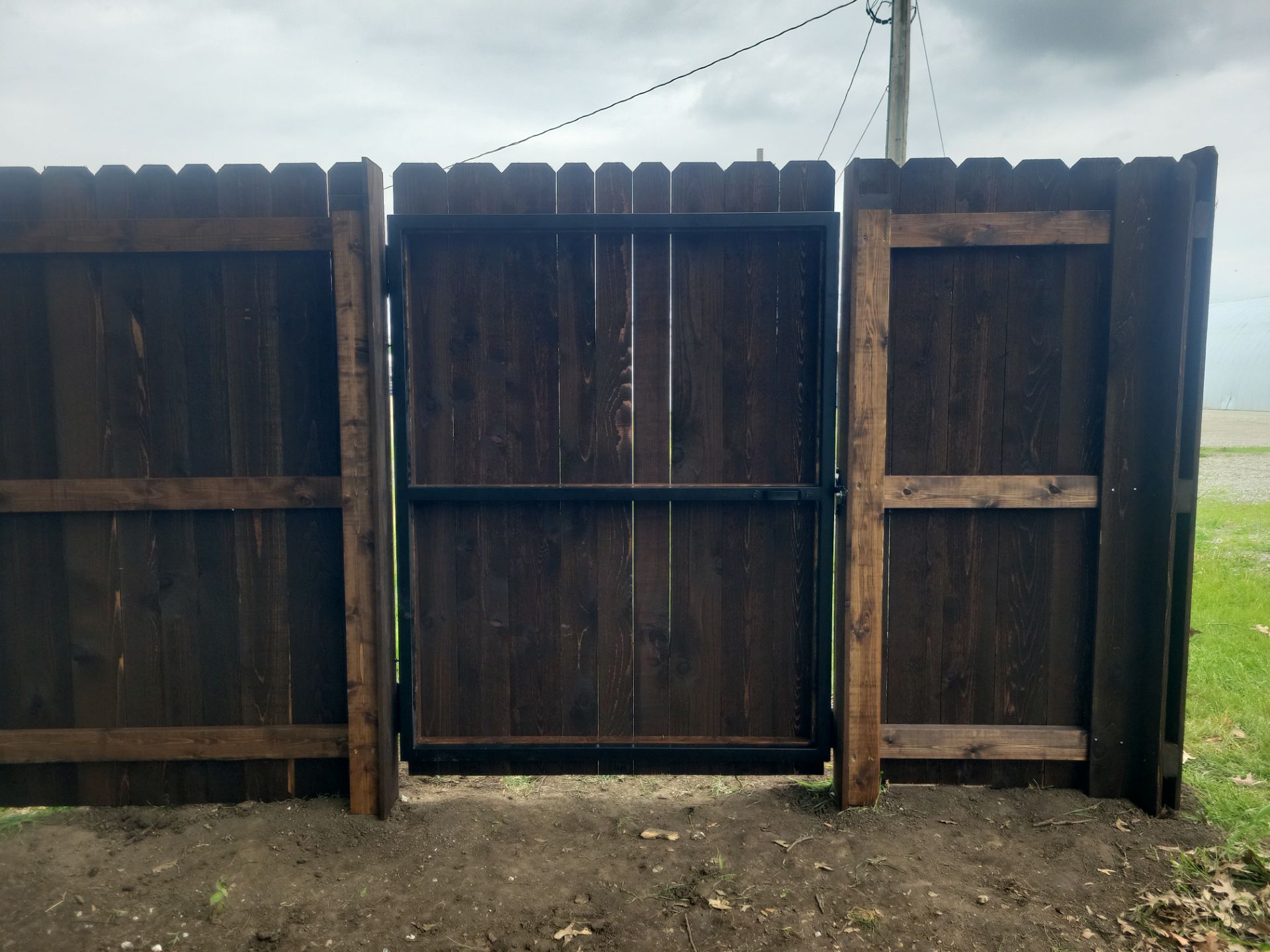 Chain Link and Cedar Privacy in Grundy Center by Perfect Picket Fence and Stain