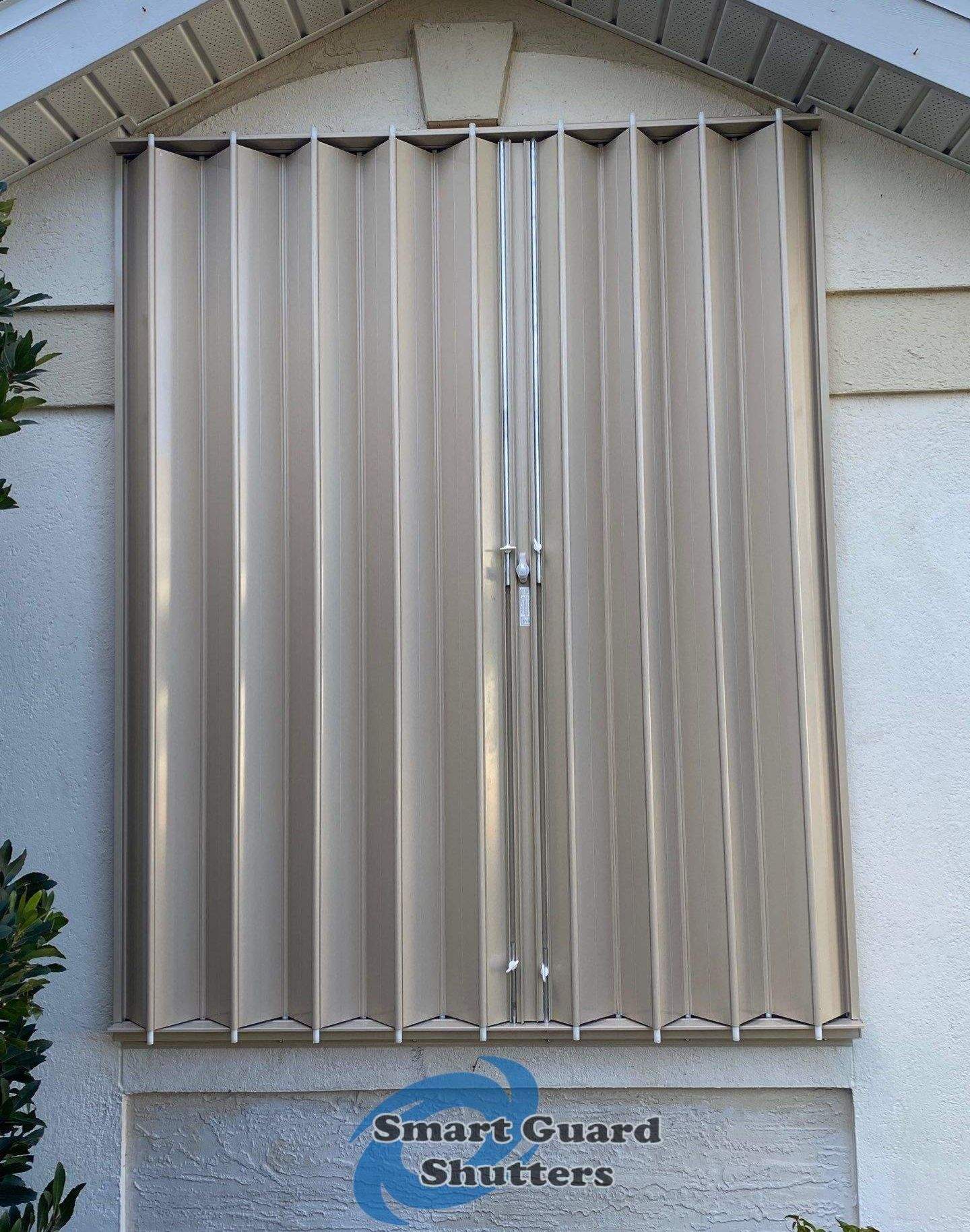 Accordion Shutters in Beige by Smart Guard Shutters