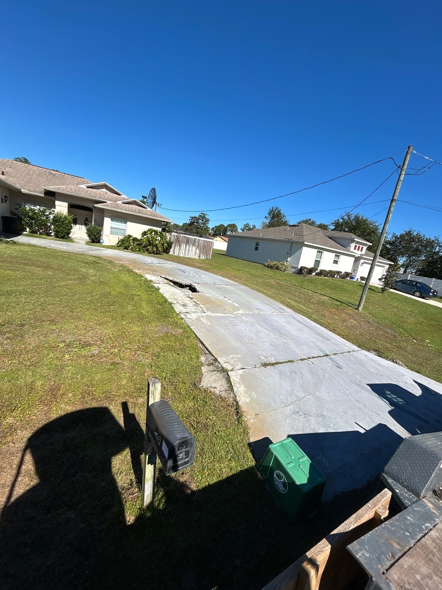 New concrete driveway by Courtesy screening