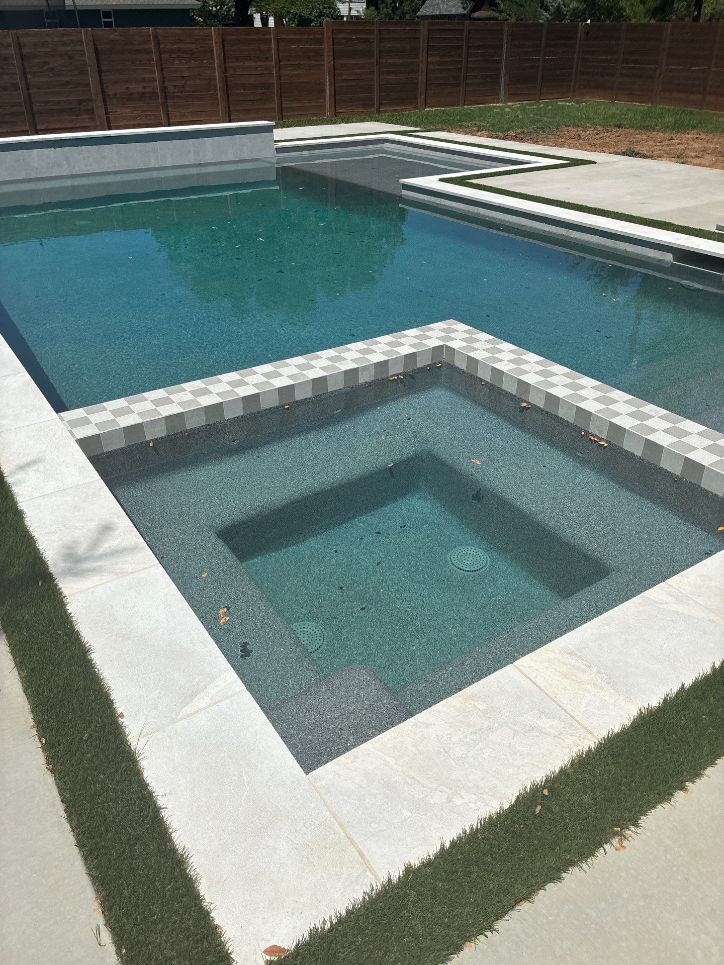 Modern Geometric Pool with Integrated Spa and Turf-Inlaid Decking by Pinnacle Pools and Spas - DFW