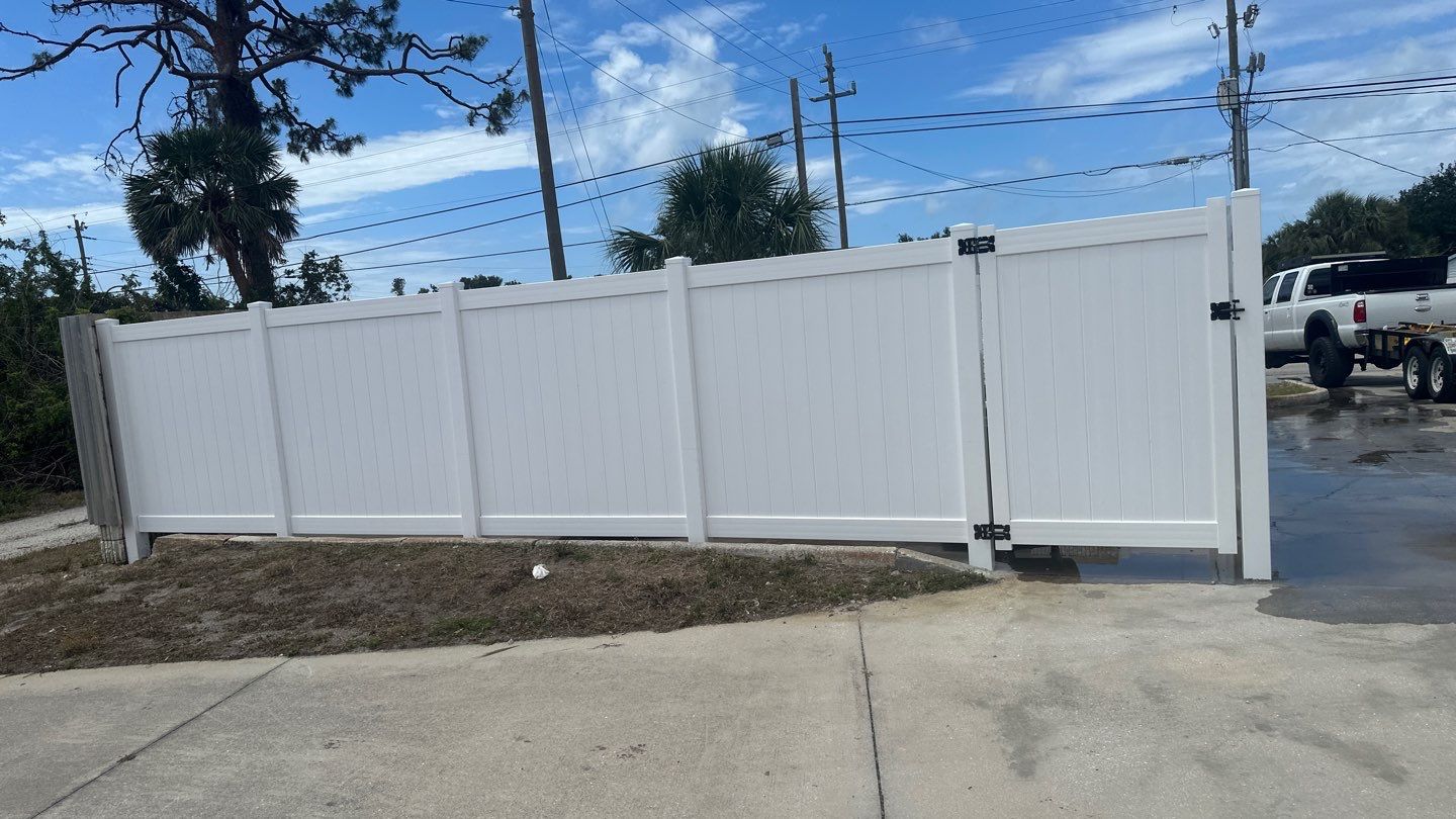 Commercial Chainlink and Vinyl Fence With Aluminum Framed Gates On Dumpster Enclosure by Asap fence and gates, LLC