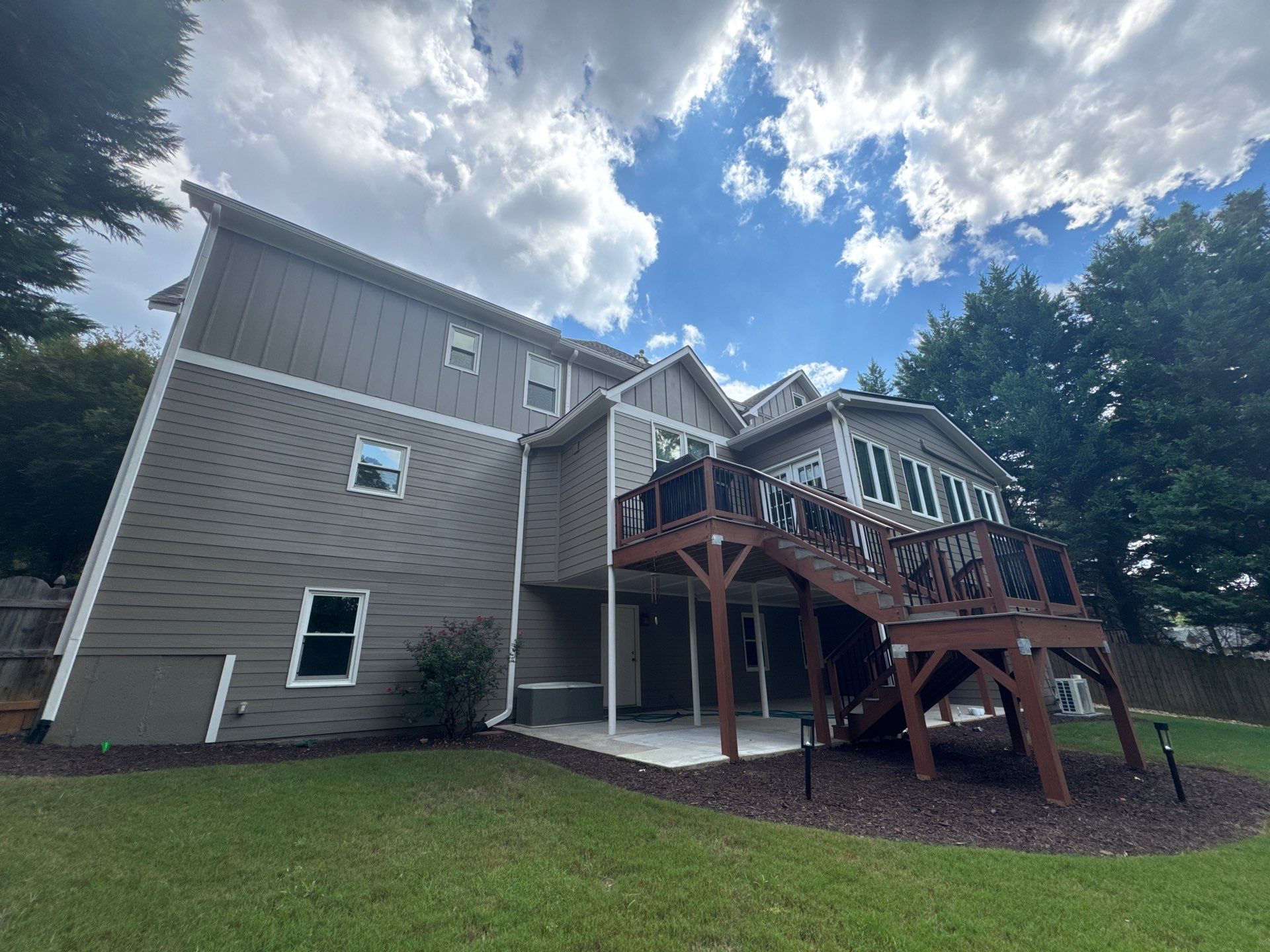 Exterior Modernization Featuring New Siding and Custom Wood Portico by Swift Home Renovations