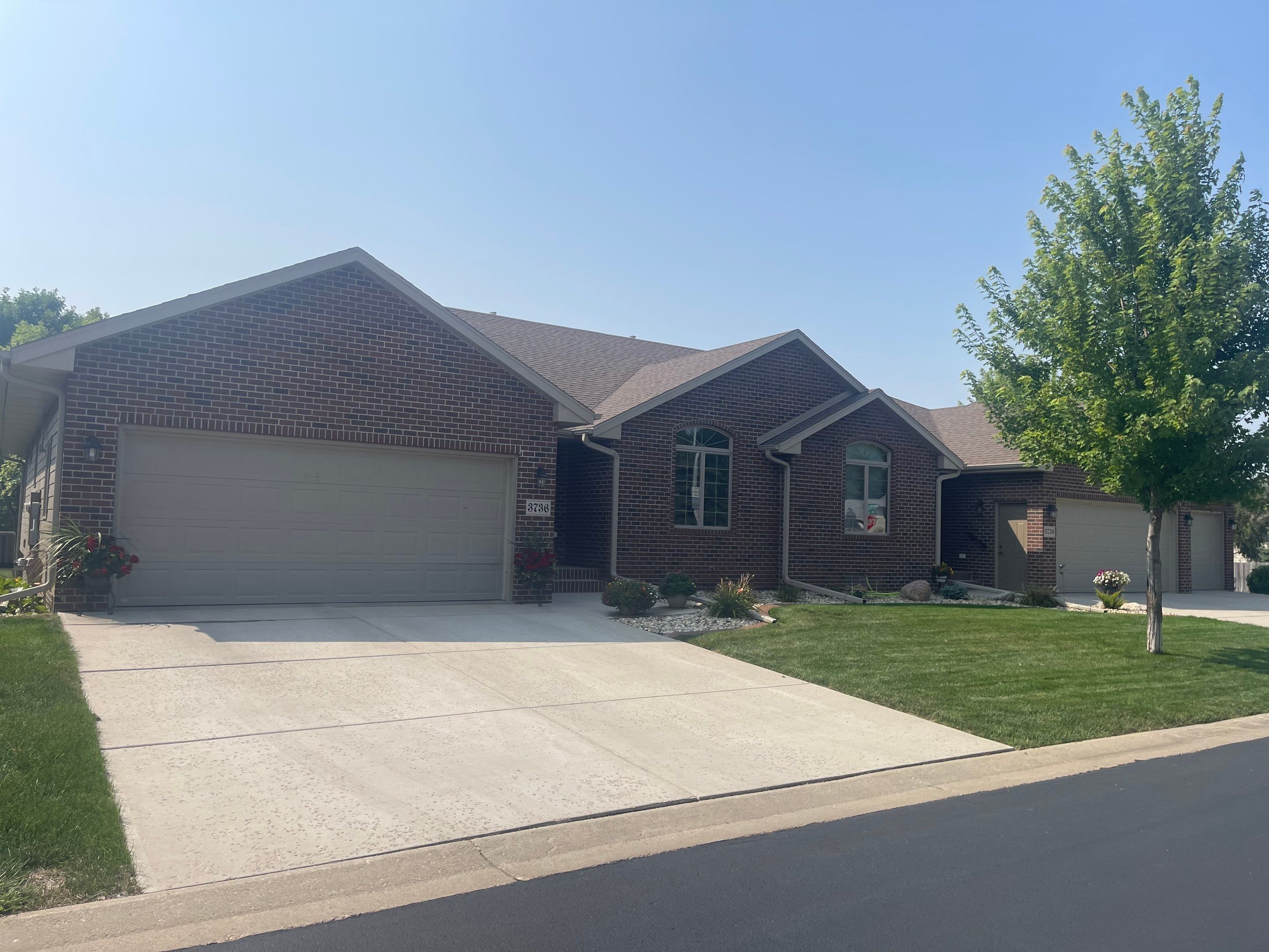 Residential Exterior Siding and Trim Painting in Sioux Falls by Select Painting, Coatings & Garage Cabinets