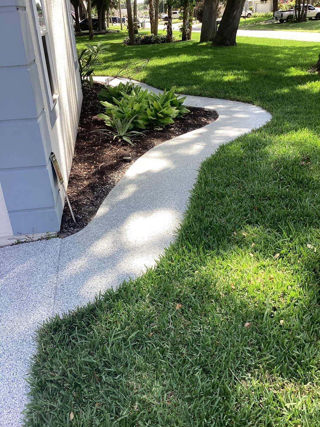 Driveway and Garage using Tidal Wave by Amvet concrete coatings llc