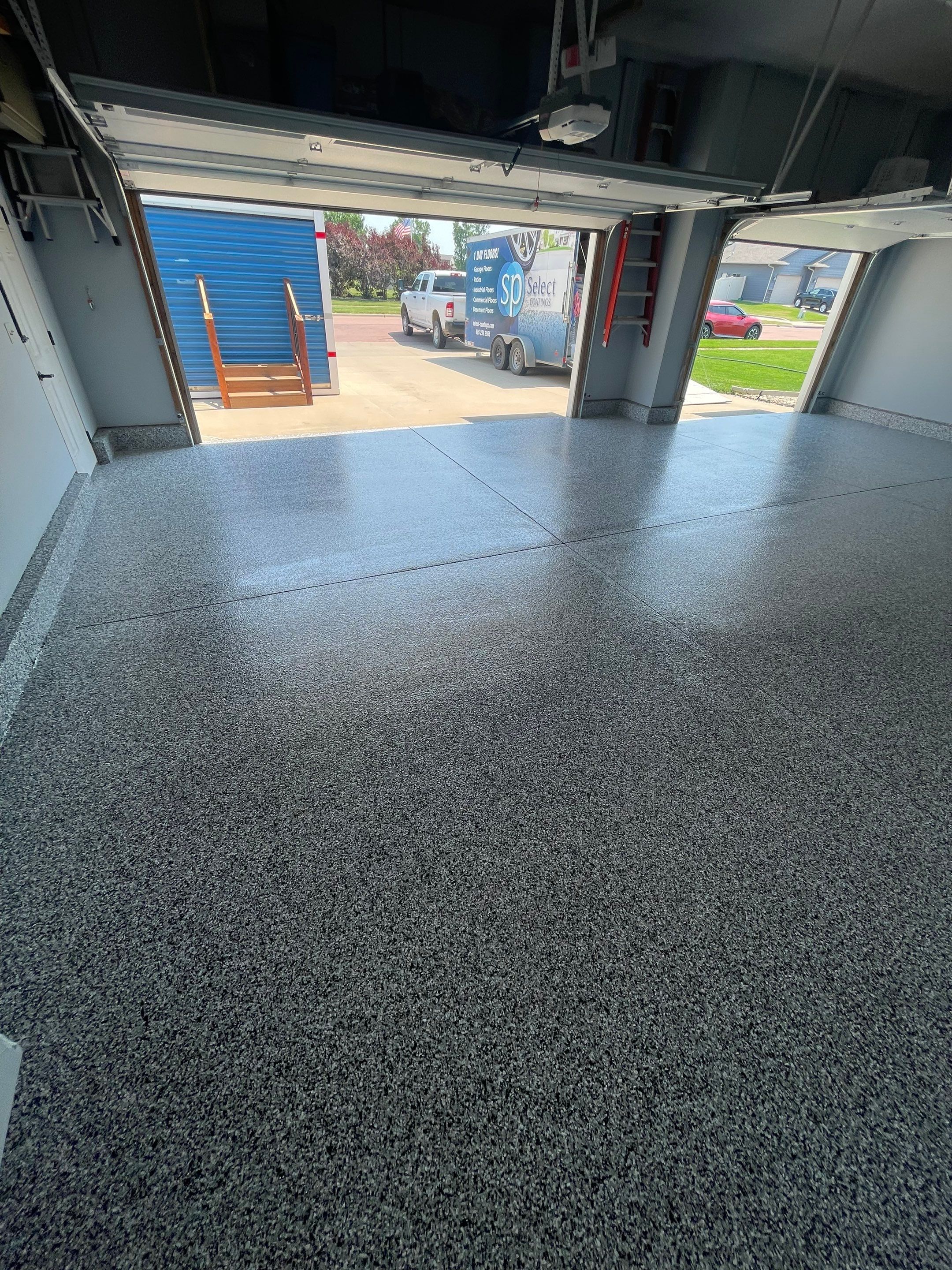 Sioux Falls Garage Concrete Coating Installation with Domino Flake by Select Painting, Coatings & Garage Cabinets