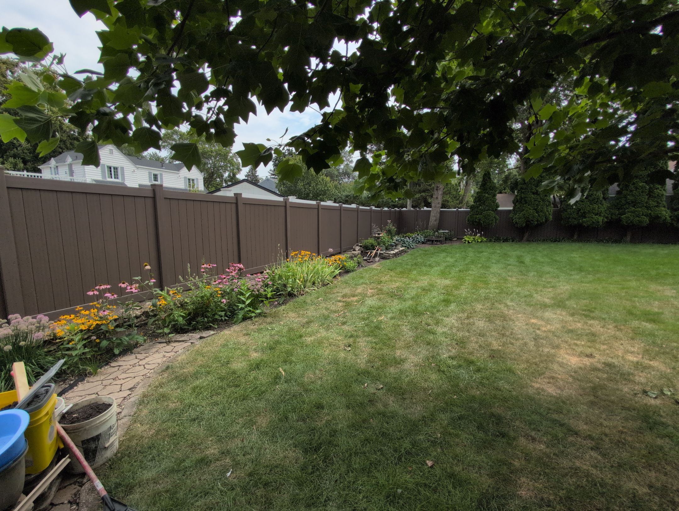 Walnut Vinyl Privacy Fence Installation in Waterloo by Perfect Picket Fence and Stain