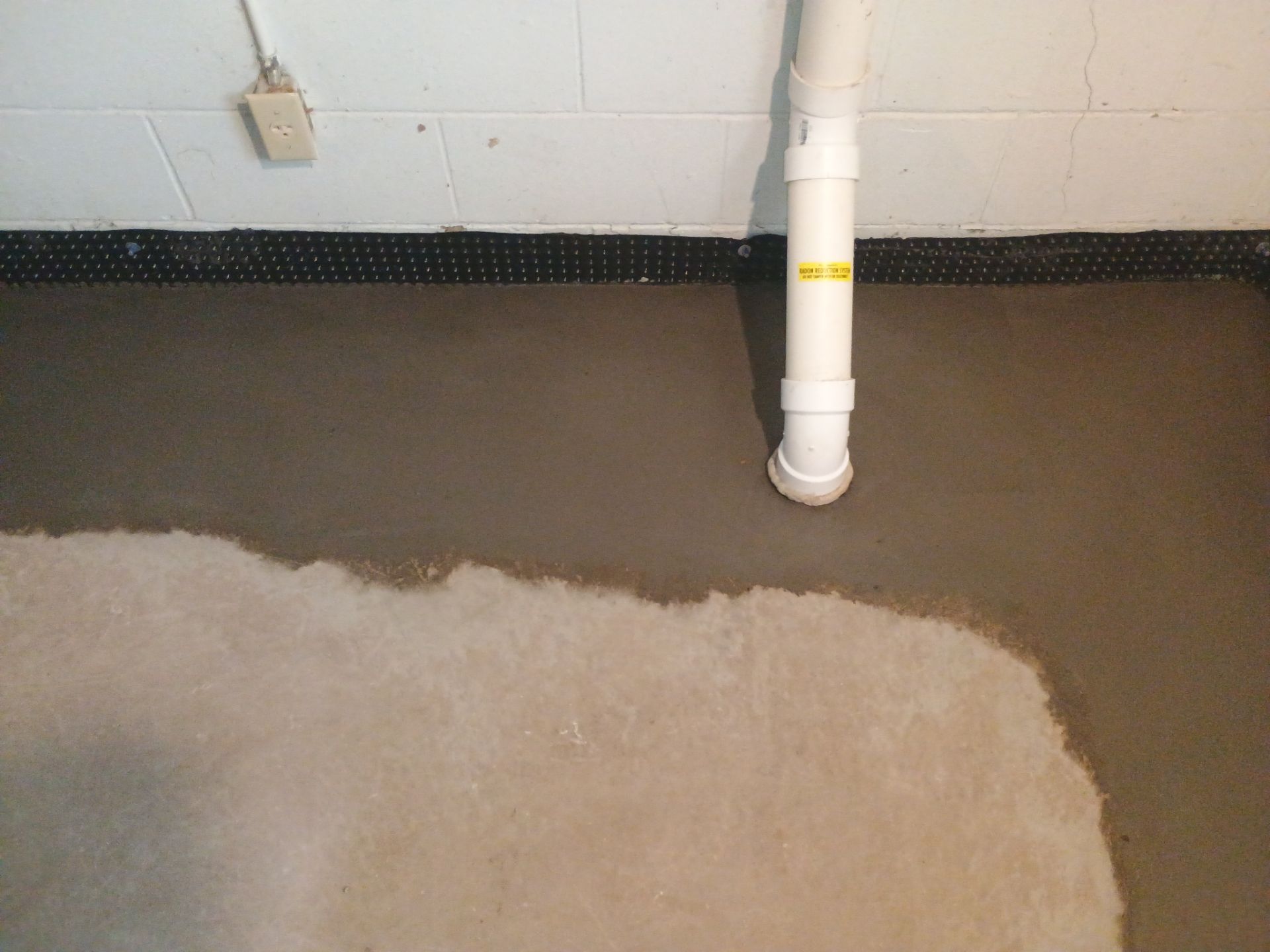 Interior Drain Tile Installation in South Minneapolis by Waterproofing Northeast