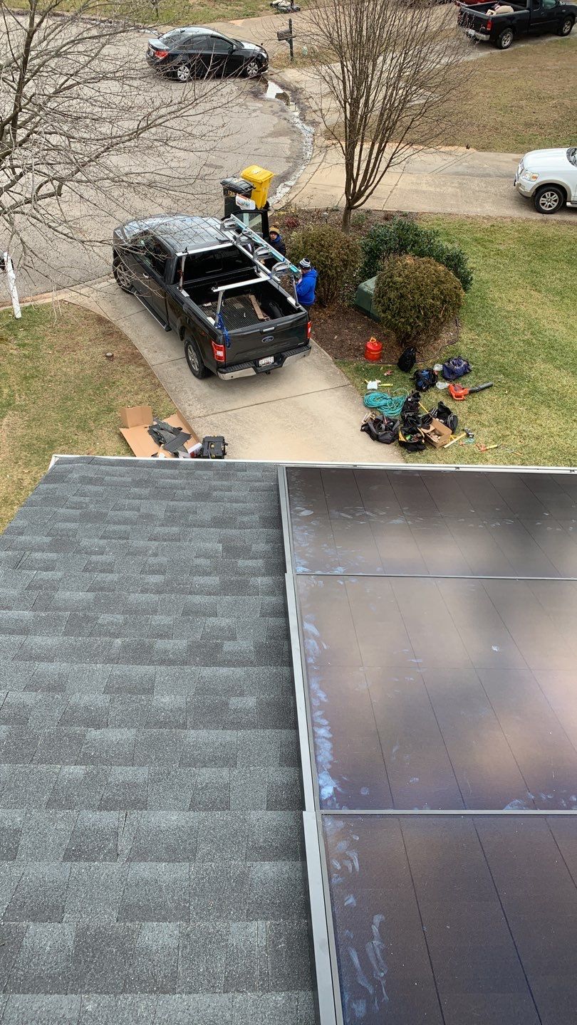 Roof Replacement with GAF Decotech integrated solar panels by American Home Contractors